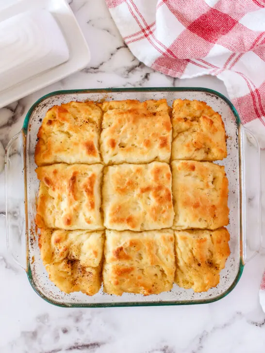 baked biscuit dough cut into 9 sections and ready to eat