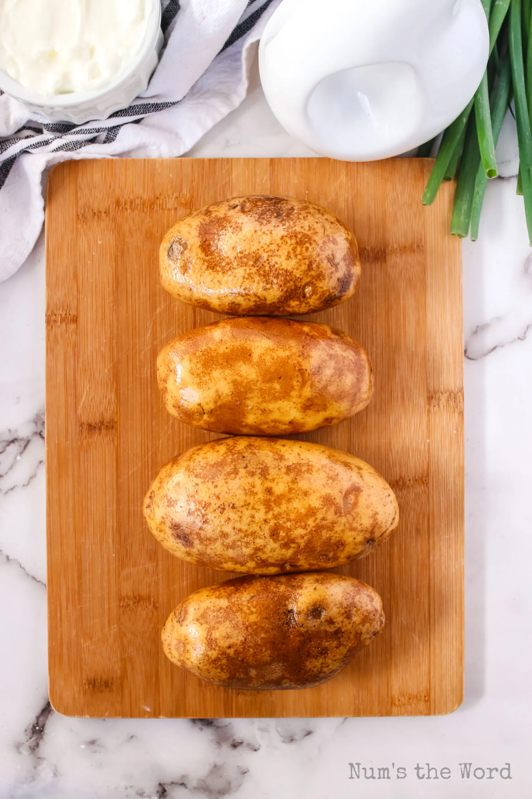 potatoes washed with prick marks, ready for the air fryer