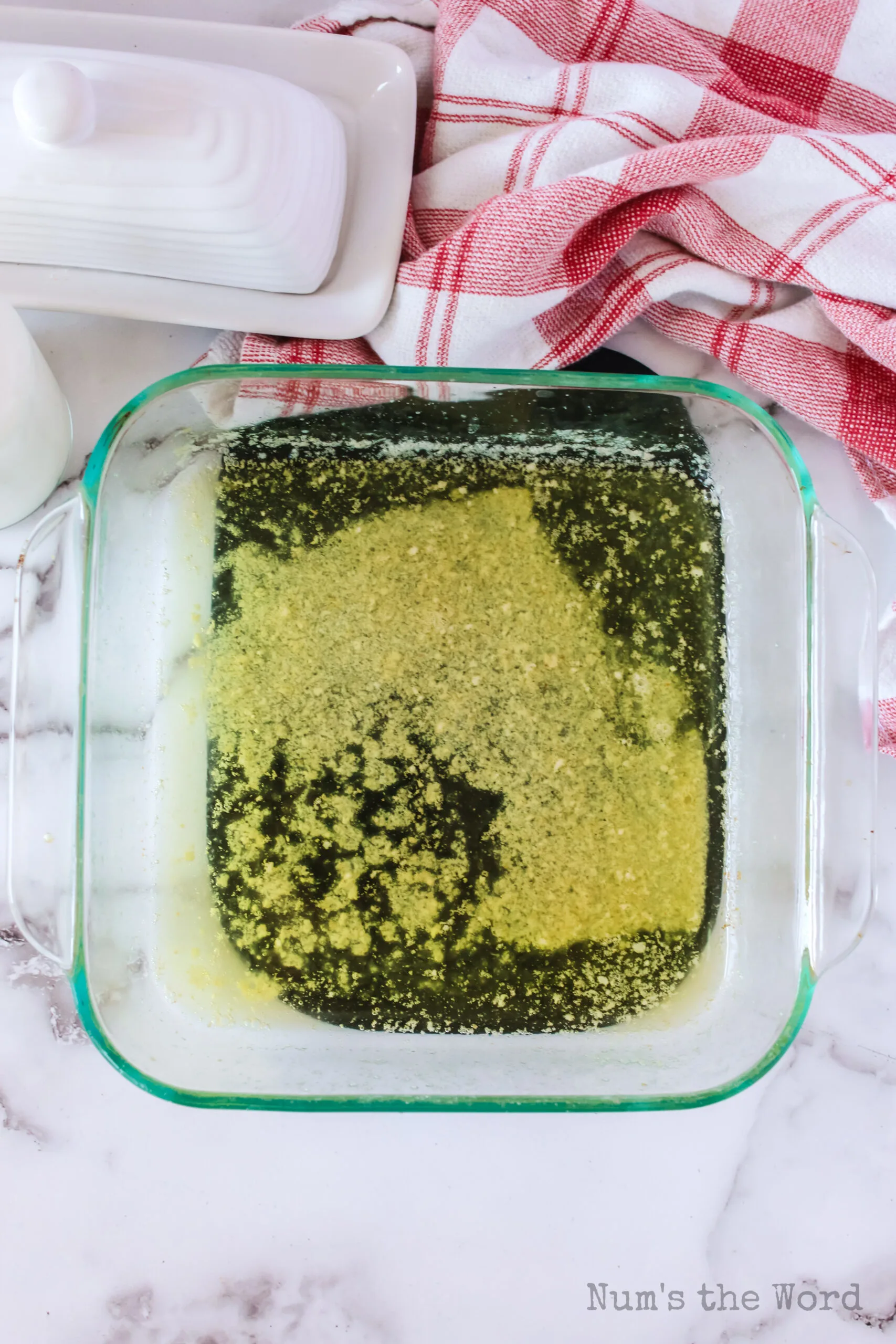 melted butter in a casserole dish