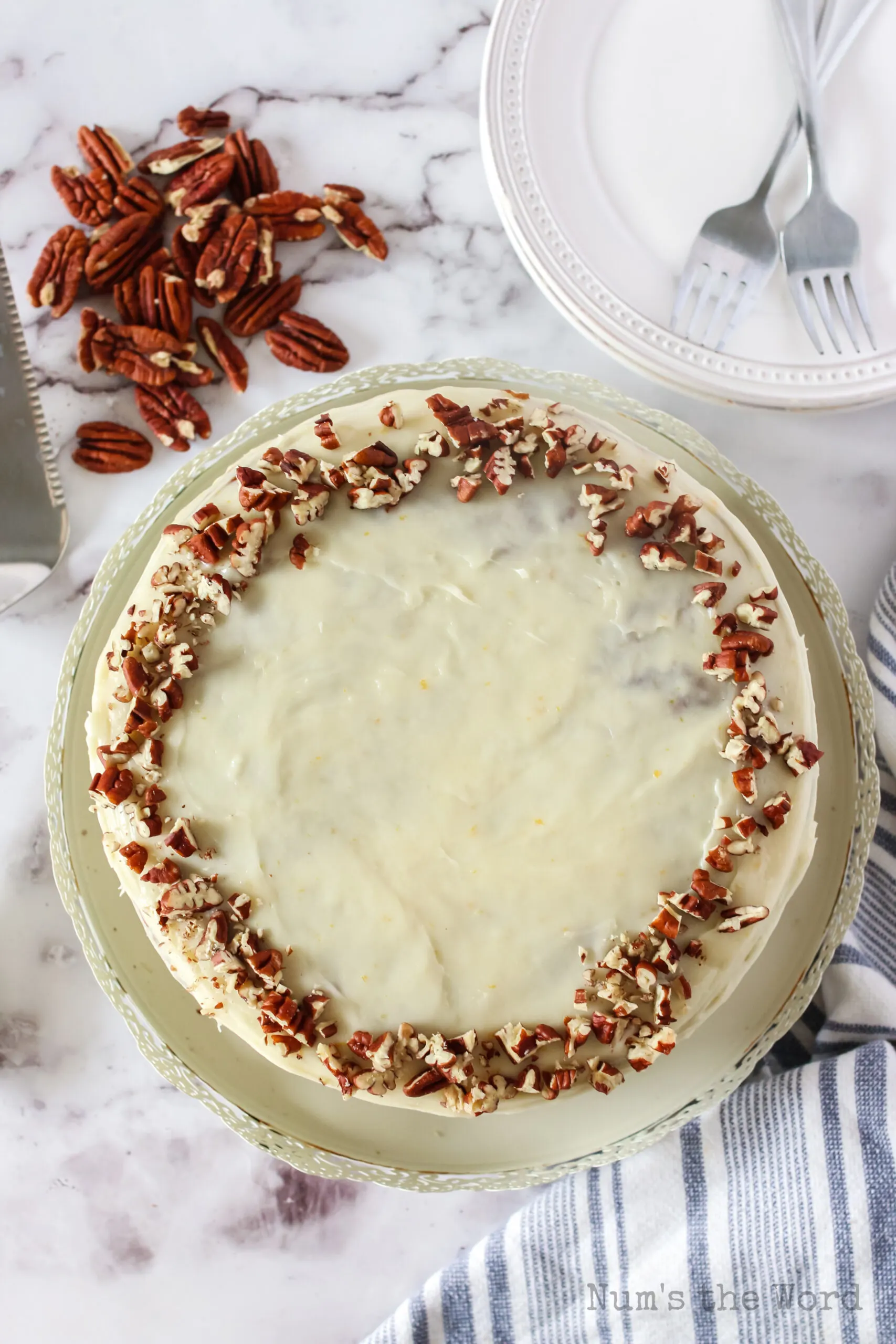 frosted and decorated carrot cake ready to serve