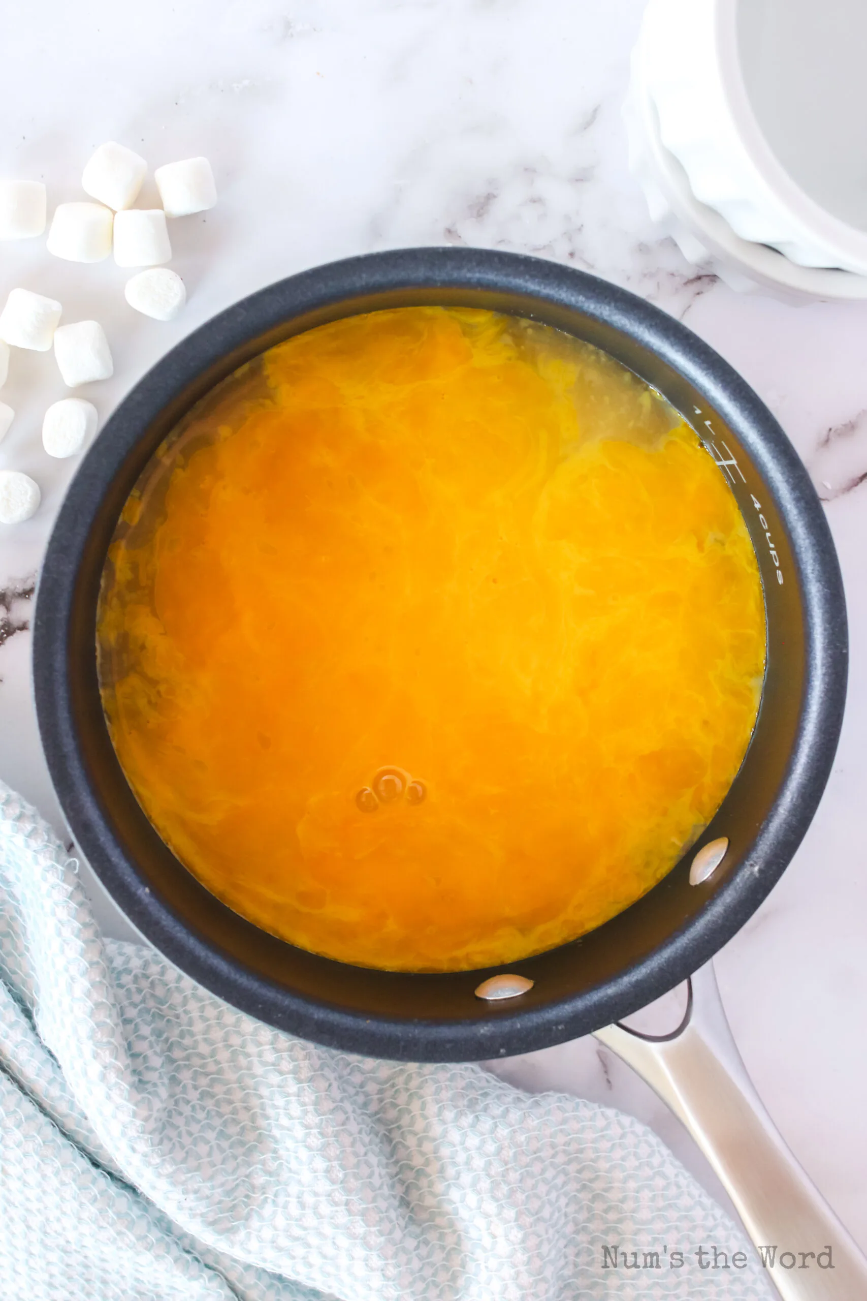 sugar, salt, egg yolks and pineapple juice in a pot
