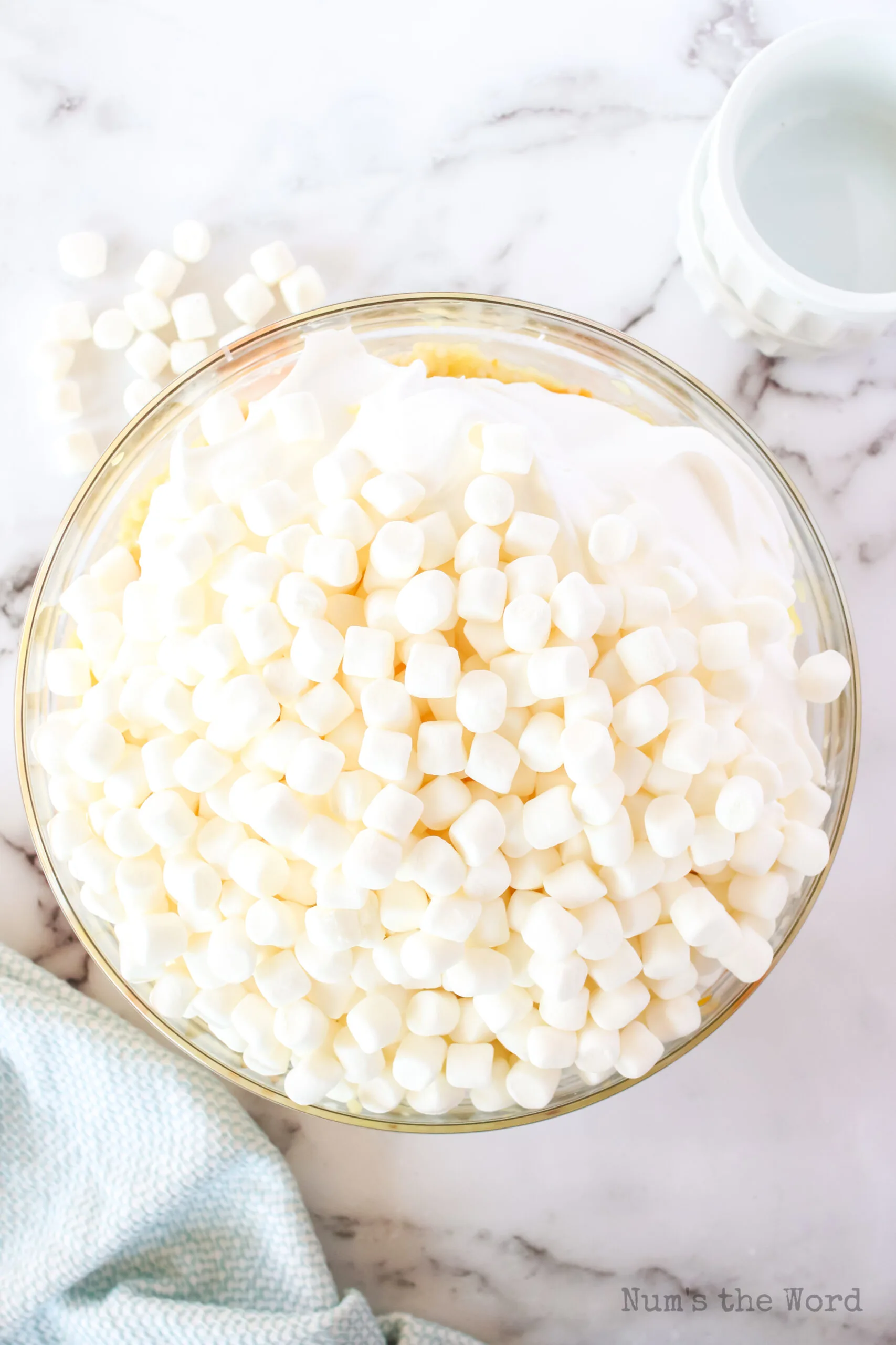 cool whip and marshmallows in a bowl unmixed