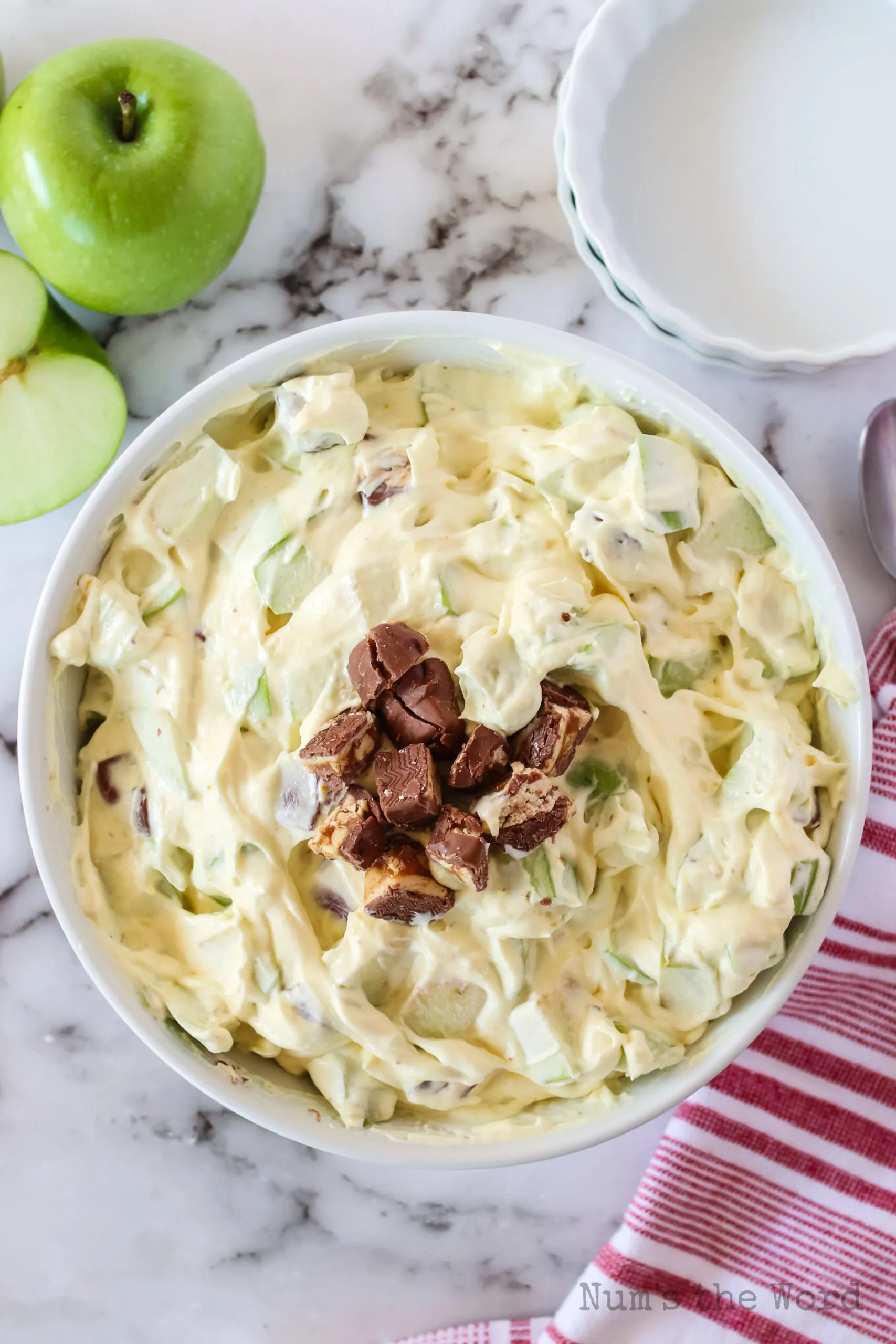 snickers salad in serving bowl with chopped snickers on top