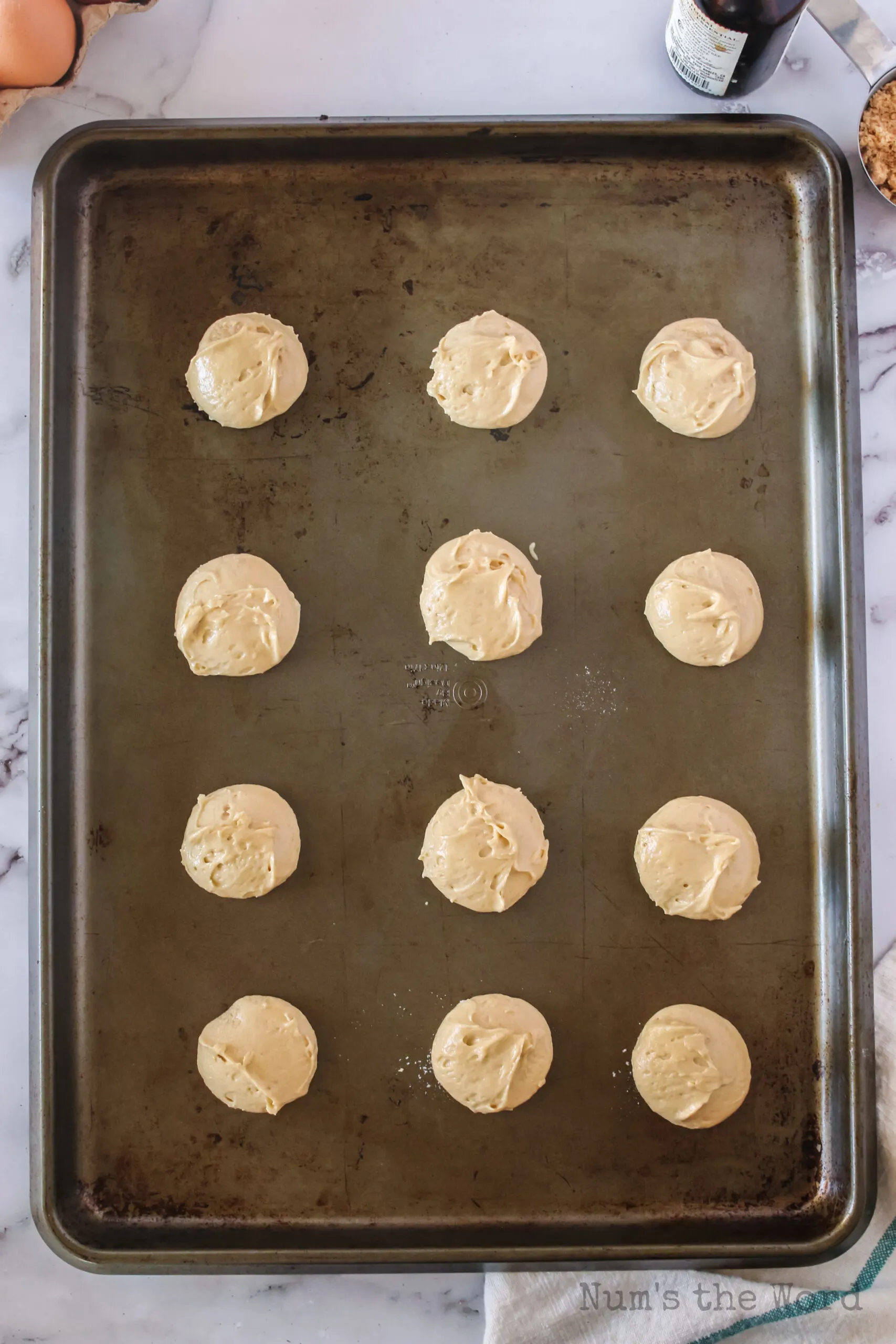 Cookie dough balls on cookie sheet