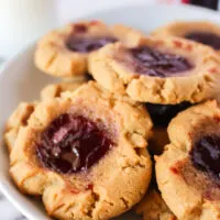 Plate full of baked peanut butter and jelly cookies