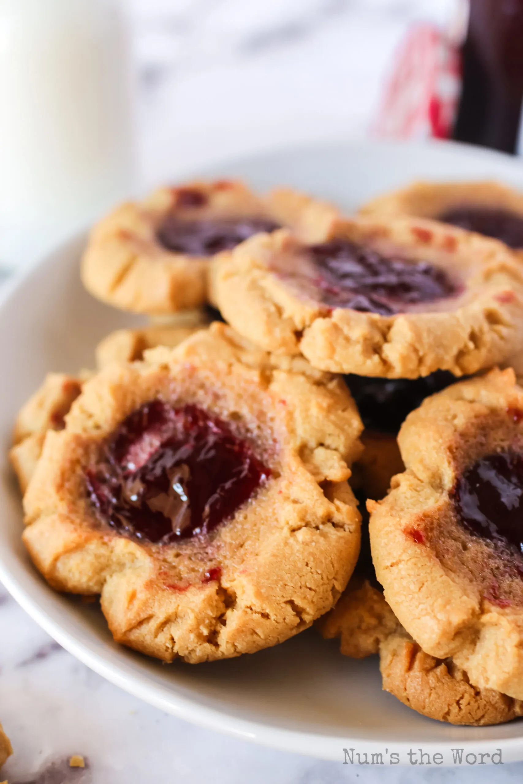 Plate full of baked peanut butter and jelly cookies