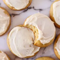 zoomed in image of cookies on counter with a bite removed from one cookie