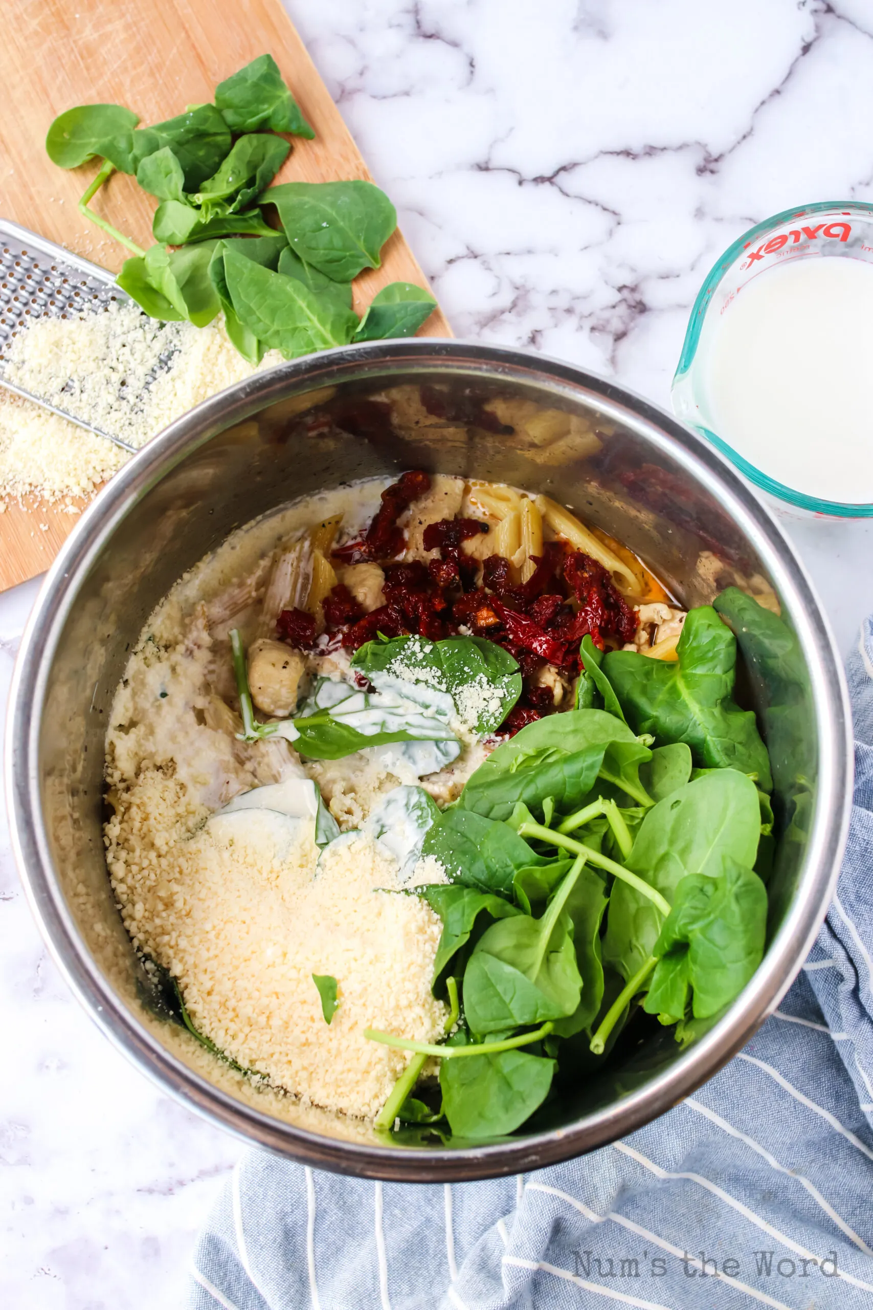 Cooked pasta with all other ingredients being added to it