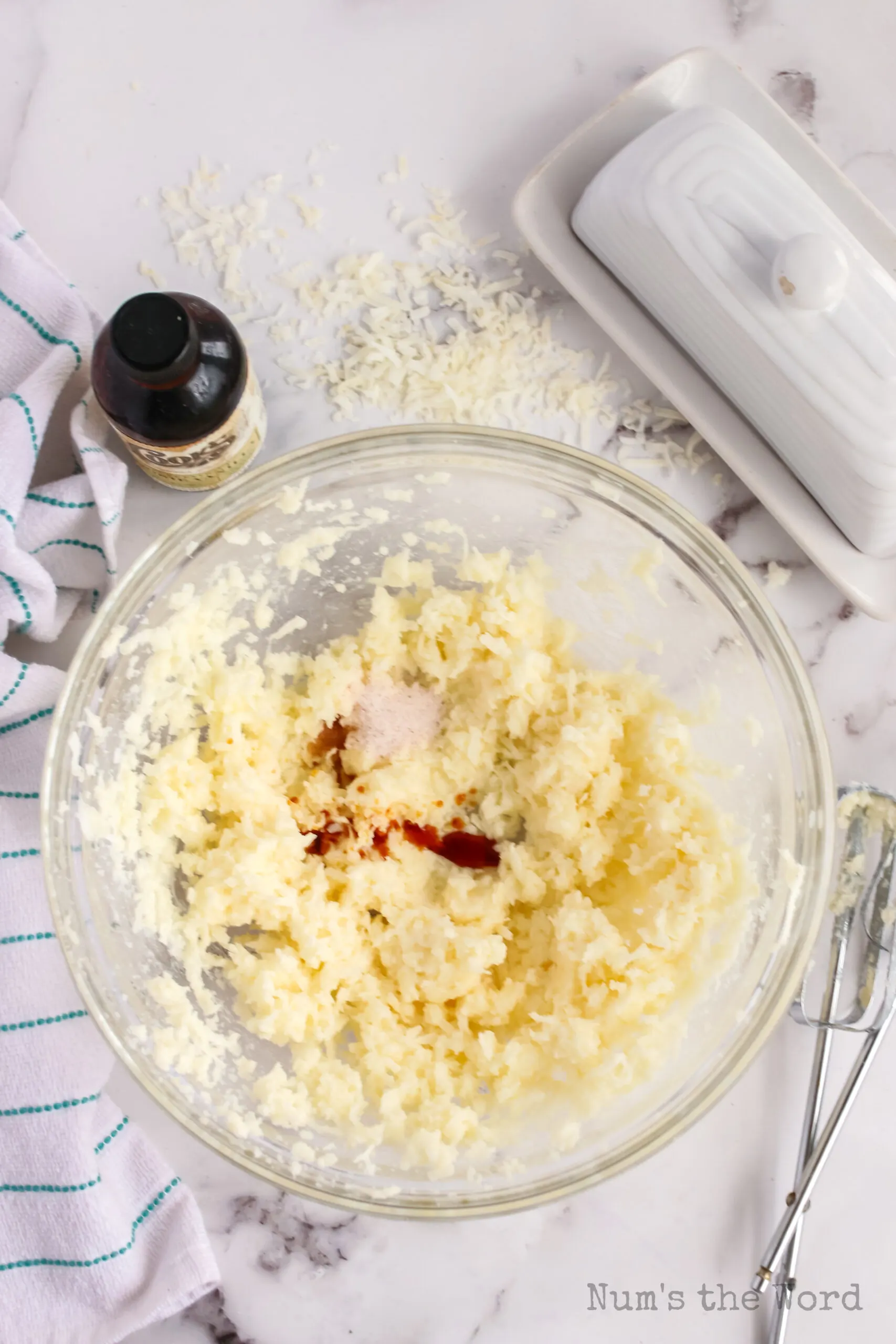 Salt and vanilla extract added to butter mixture.