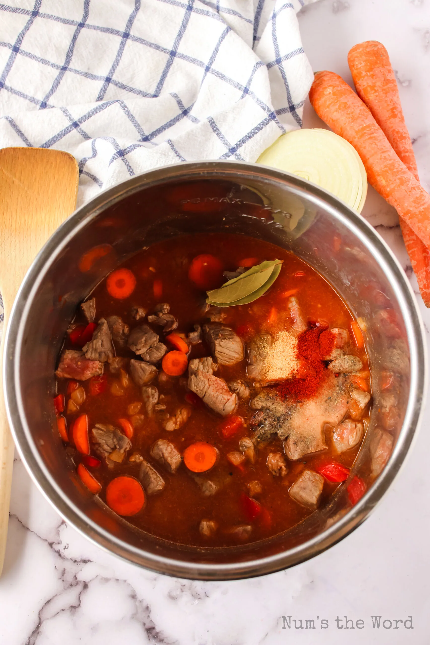 Beef added to bell pepper mixture as well as carrots, tomato sauce, seasonings and beef broth.