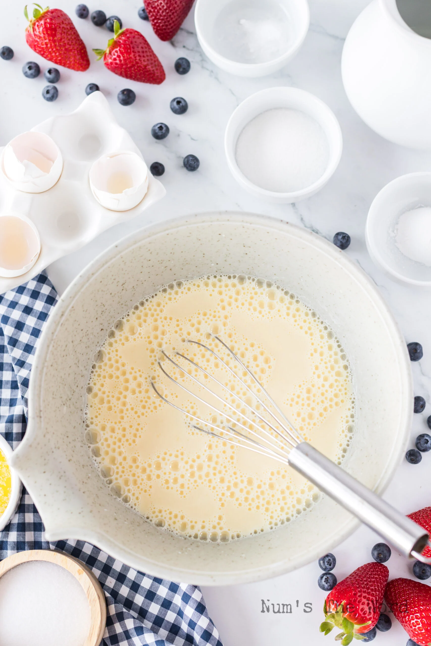 eggs and buttermilk mixed together in a bowl