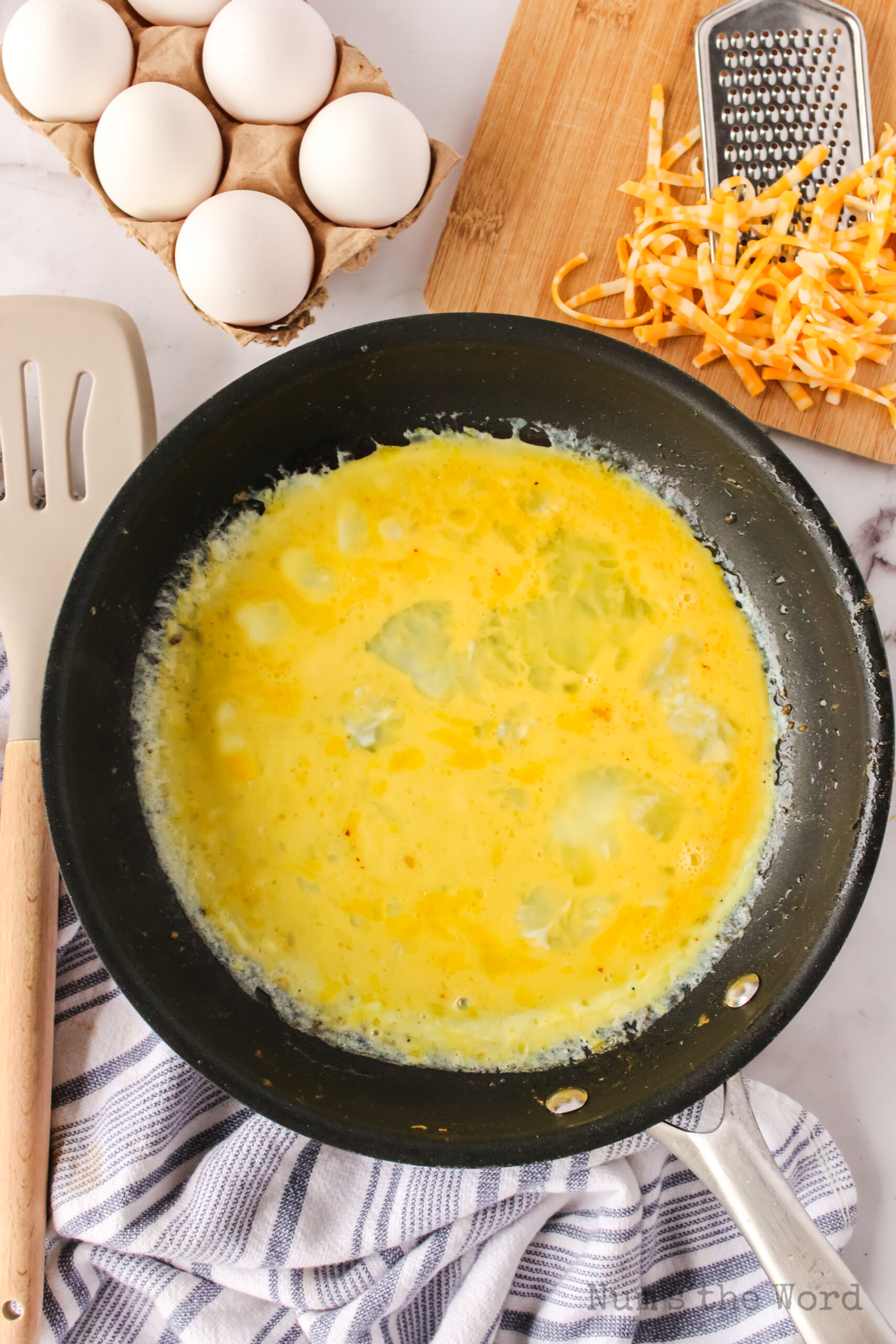 eggs in skillet, ready to be cooked