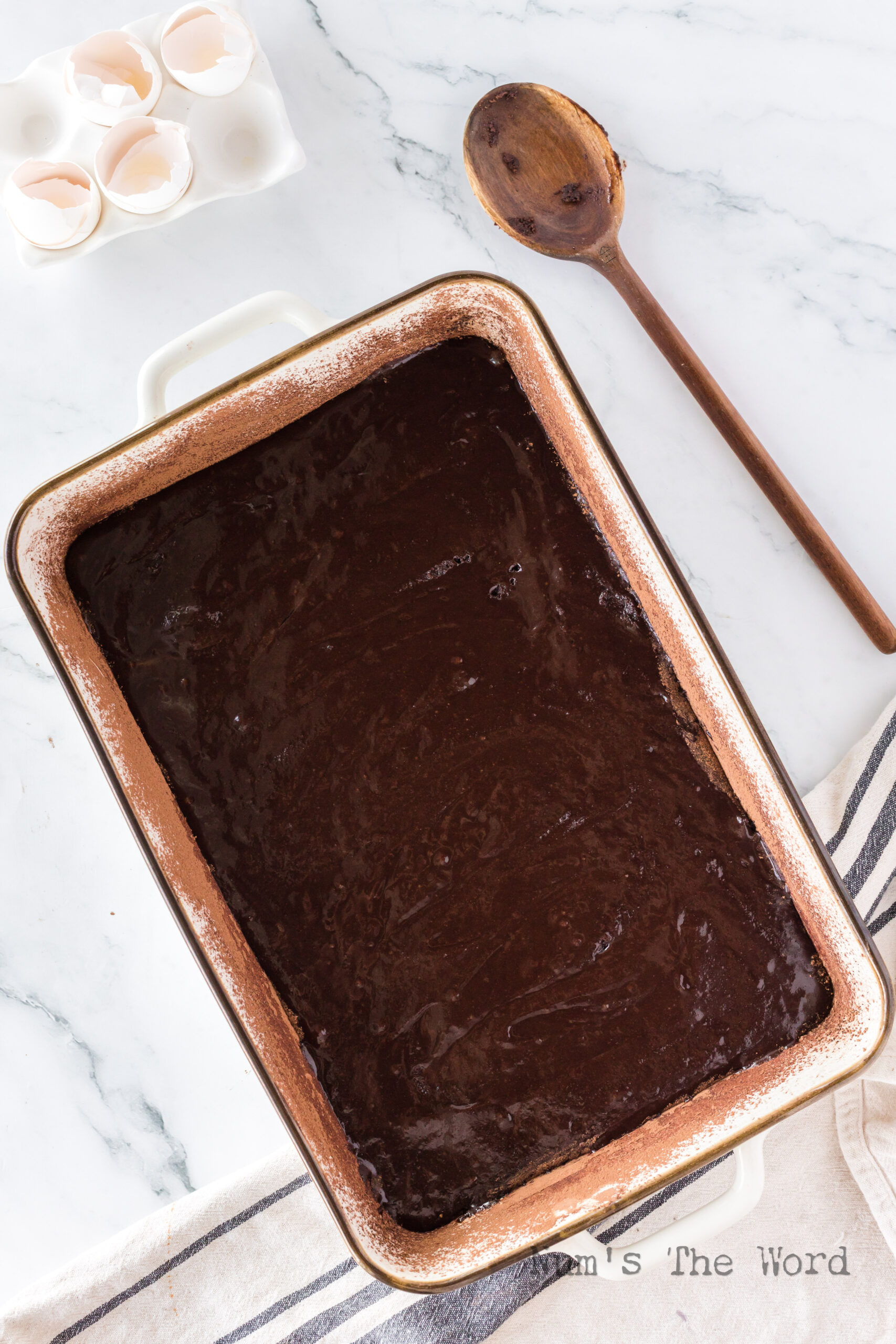 Brownie batter poured into a casserole dish