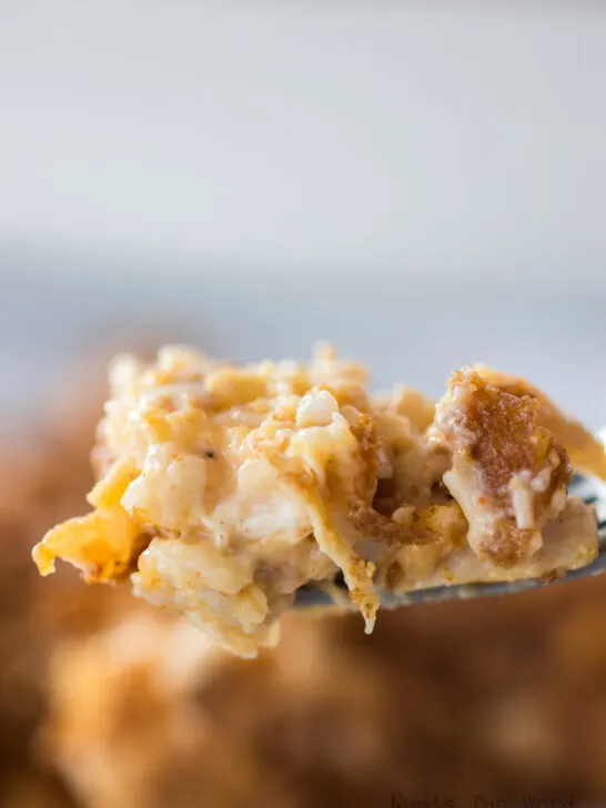 fork holding up a portion of yummy chicken and rice casserole with cornflakes
