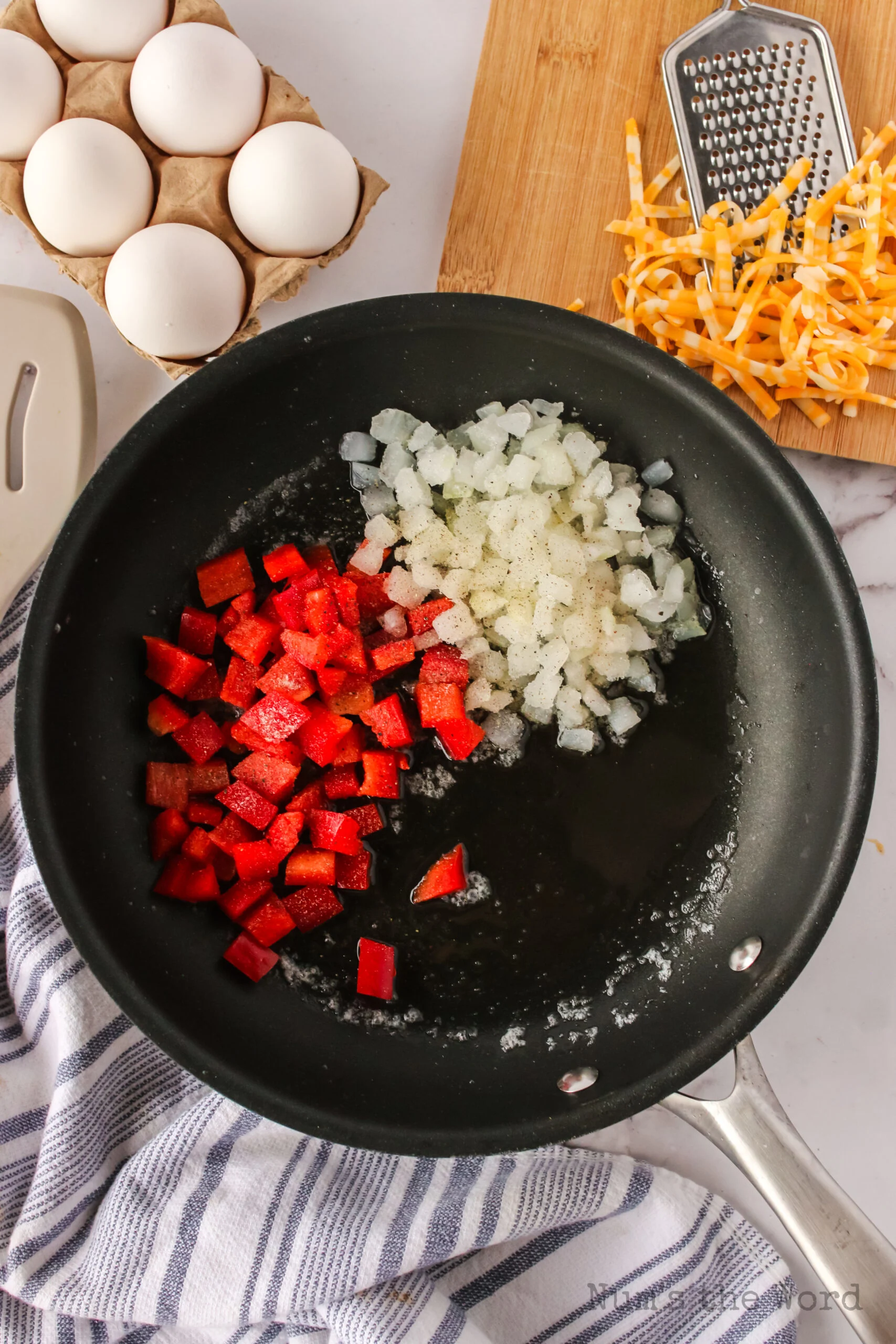 red bell pepper, butter and onion in a skillet
