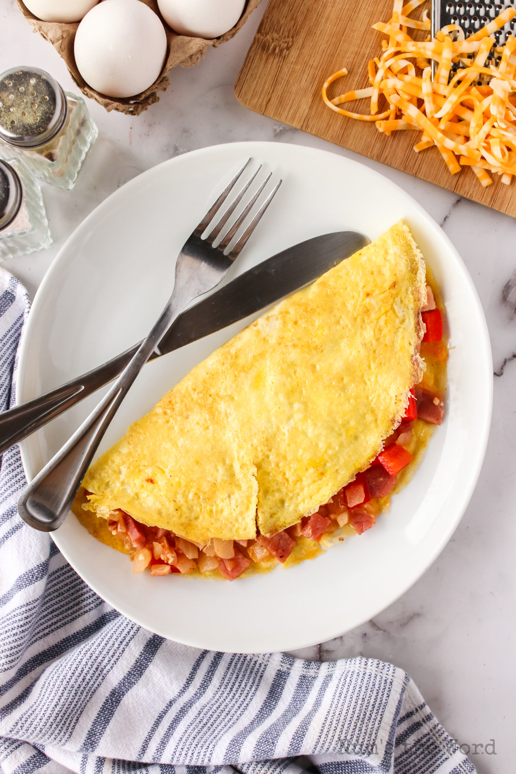 zoomed out image of omelette on a plate