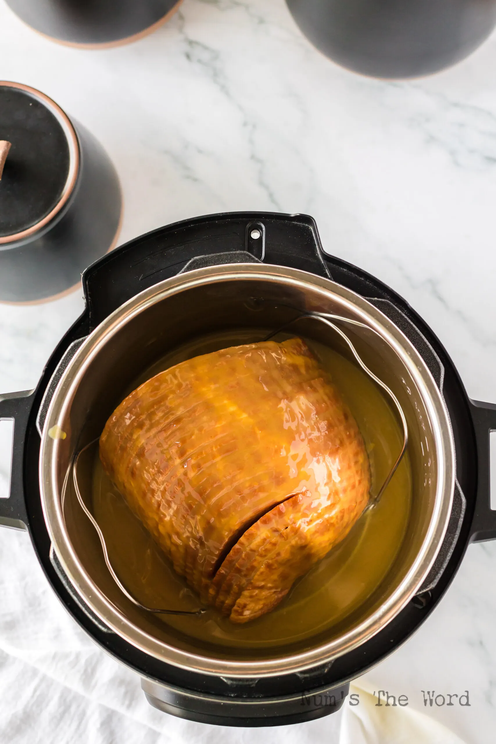 honey mustard glaze poured over ham in the instant pot