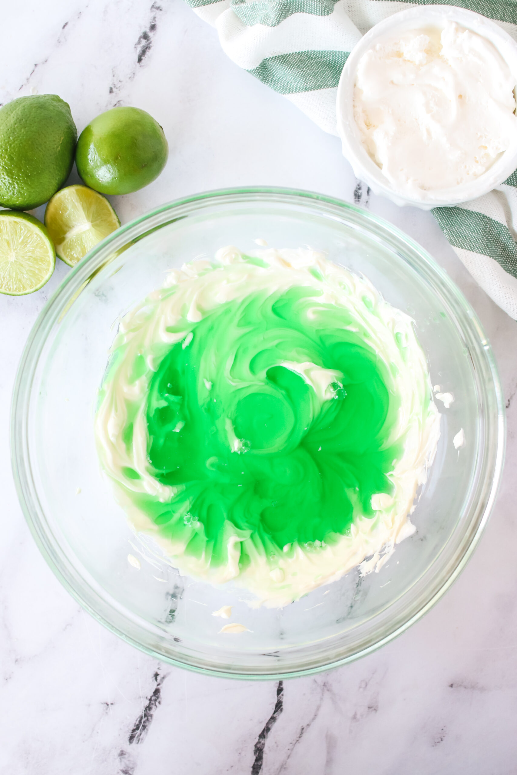 lime jello bein gadded to cream cheese