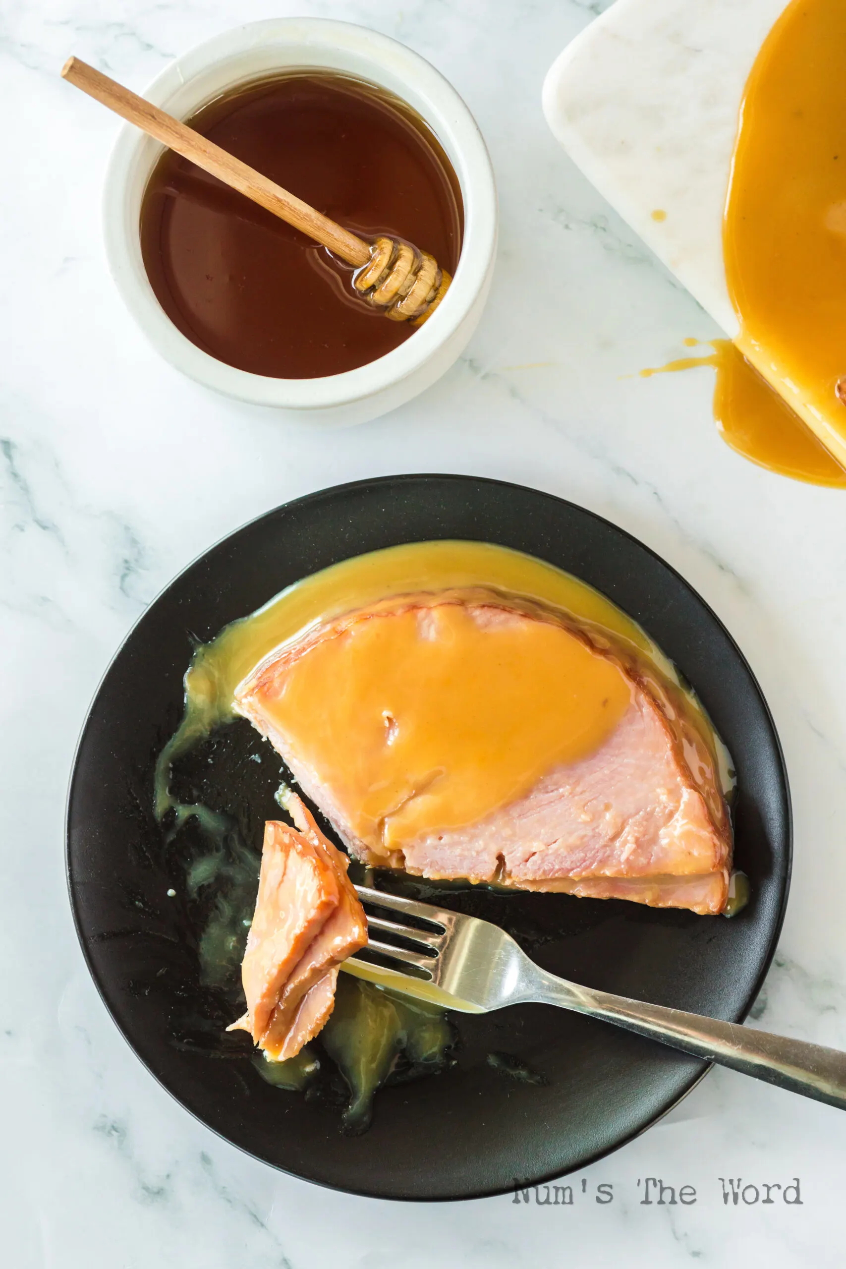 zoomed out image of a plate of ham with honey mustard glaze on top