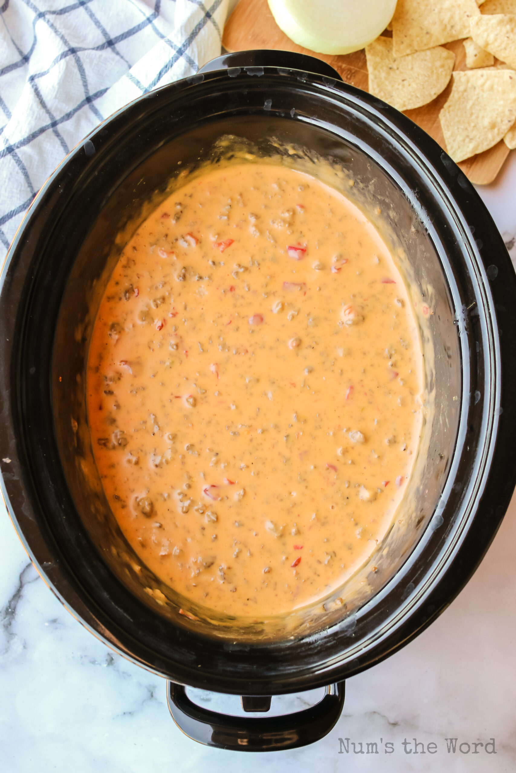 zoomed out image of cooked sausage dip in crock pot