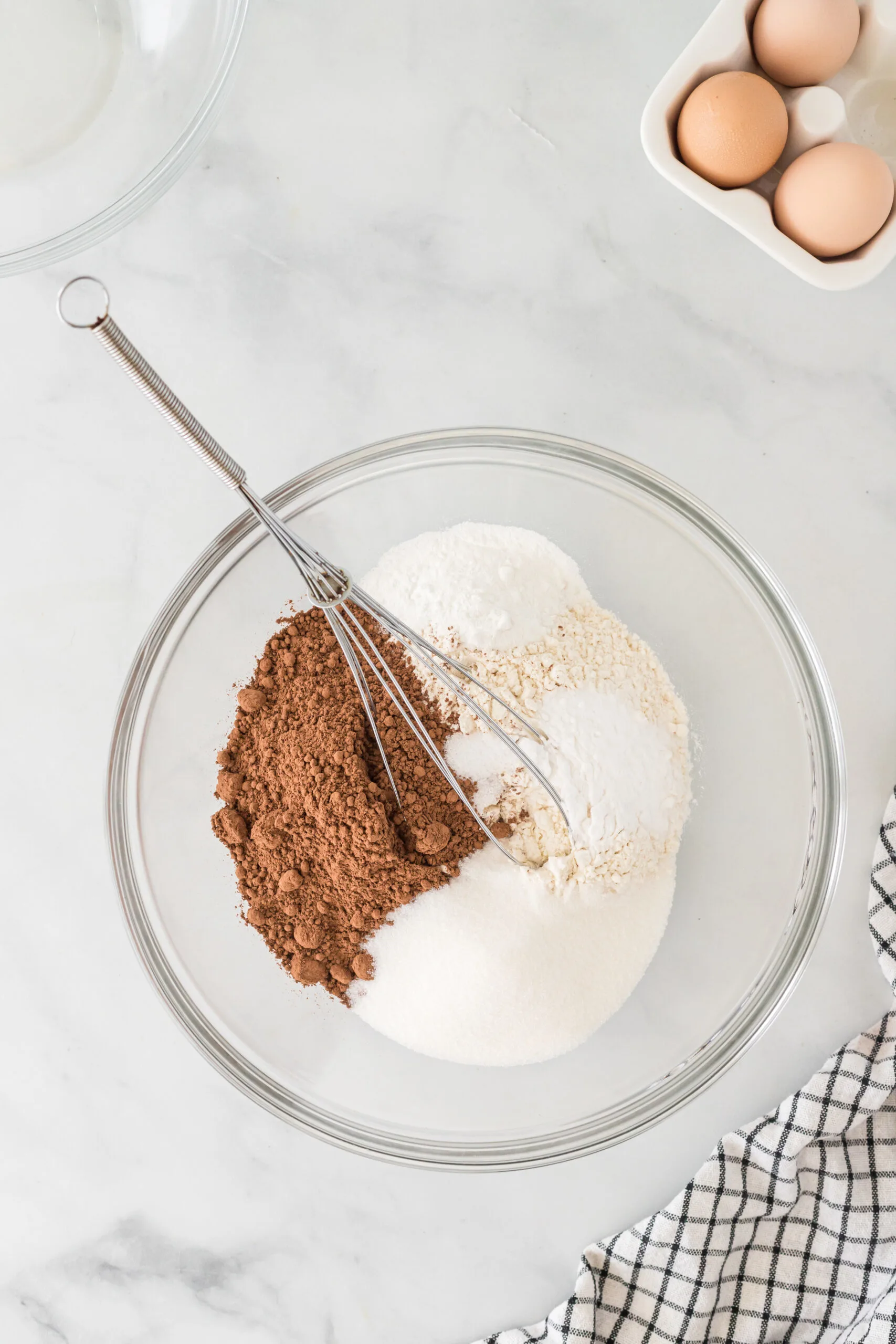 flour, cocoa powder, sugar, baking powder, baking soda, and salt in a bowl unmixed