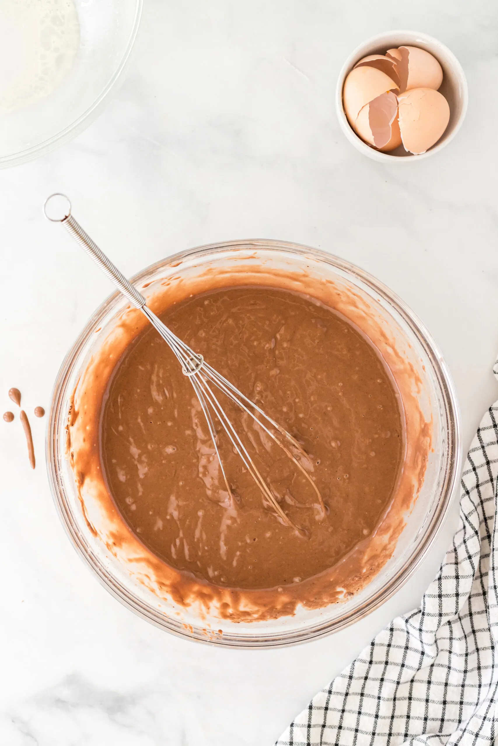 Wet chocolate waffle mixture in bowl