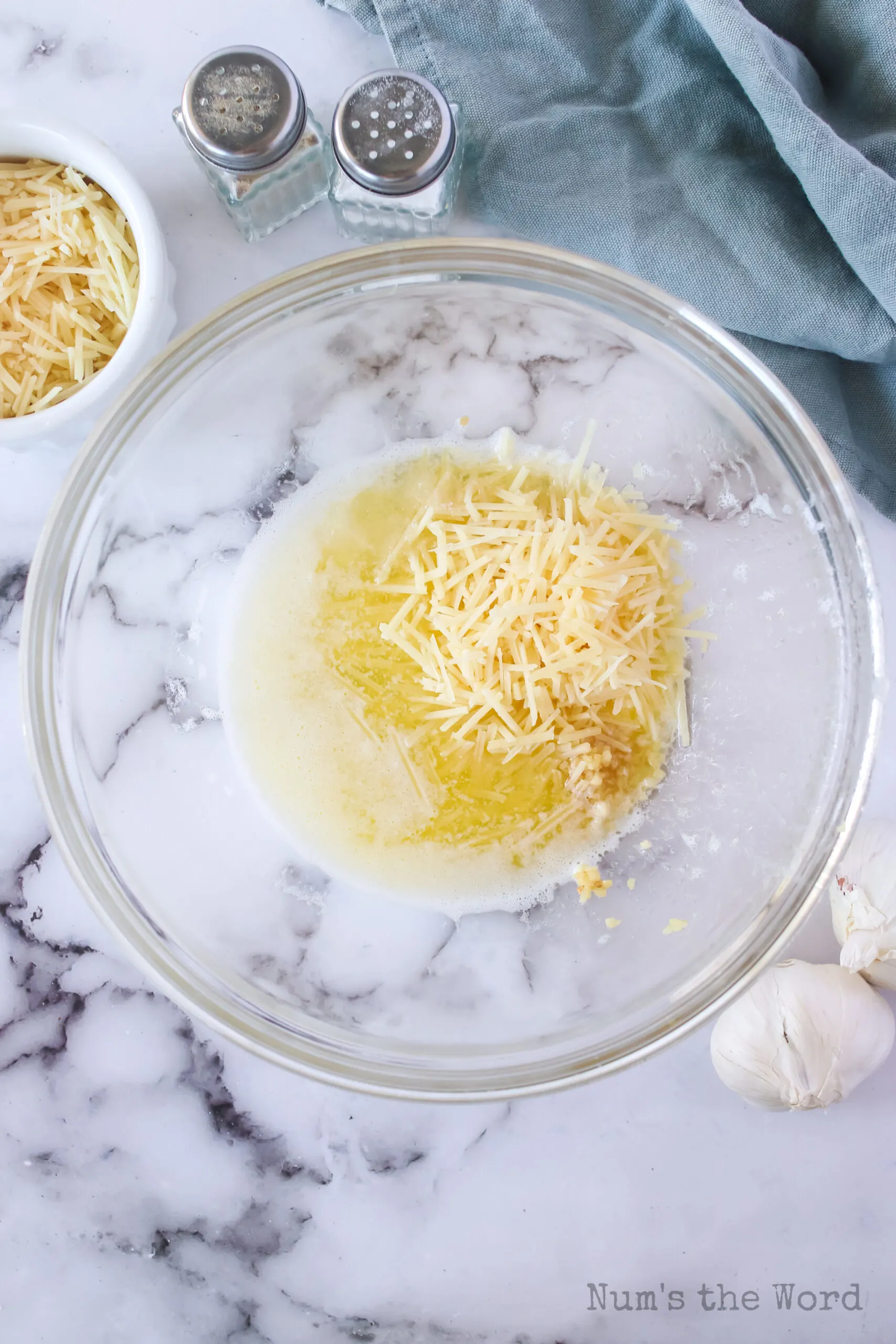 butter, garlic, salt and parmesan cheese in a bowl, unmixed