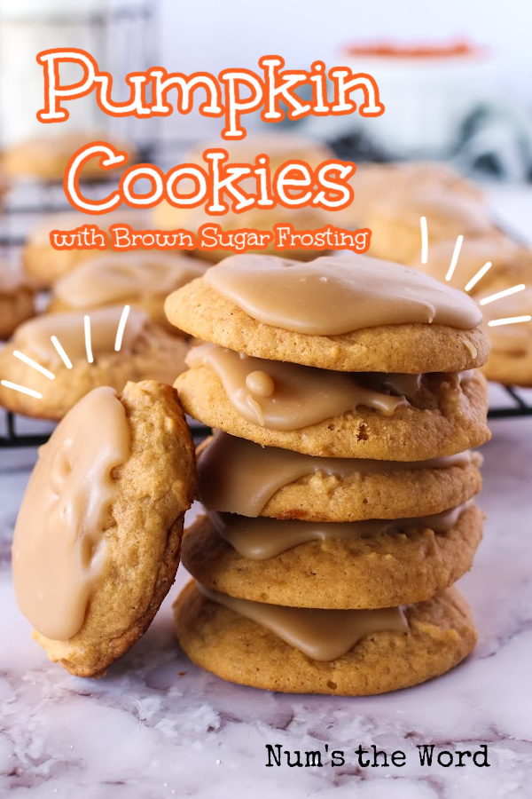 Main image for Pumpkin Cookies with Brown Sugar Frosting. 5 cookies are stacked on top of each other with one cookie leaning on it.