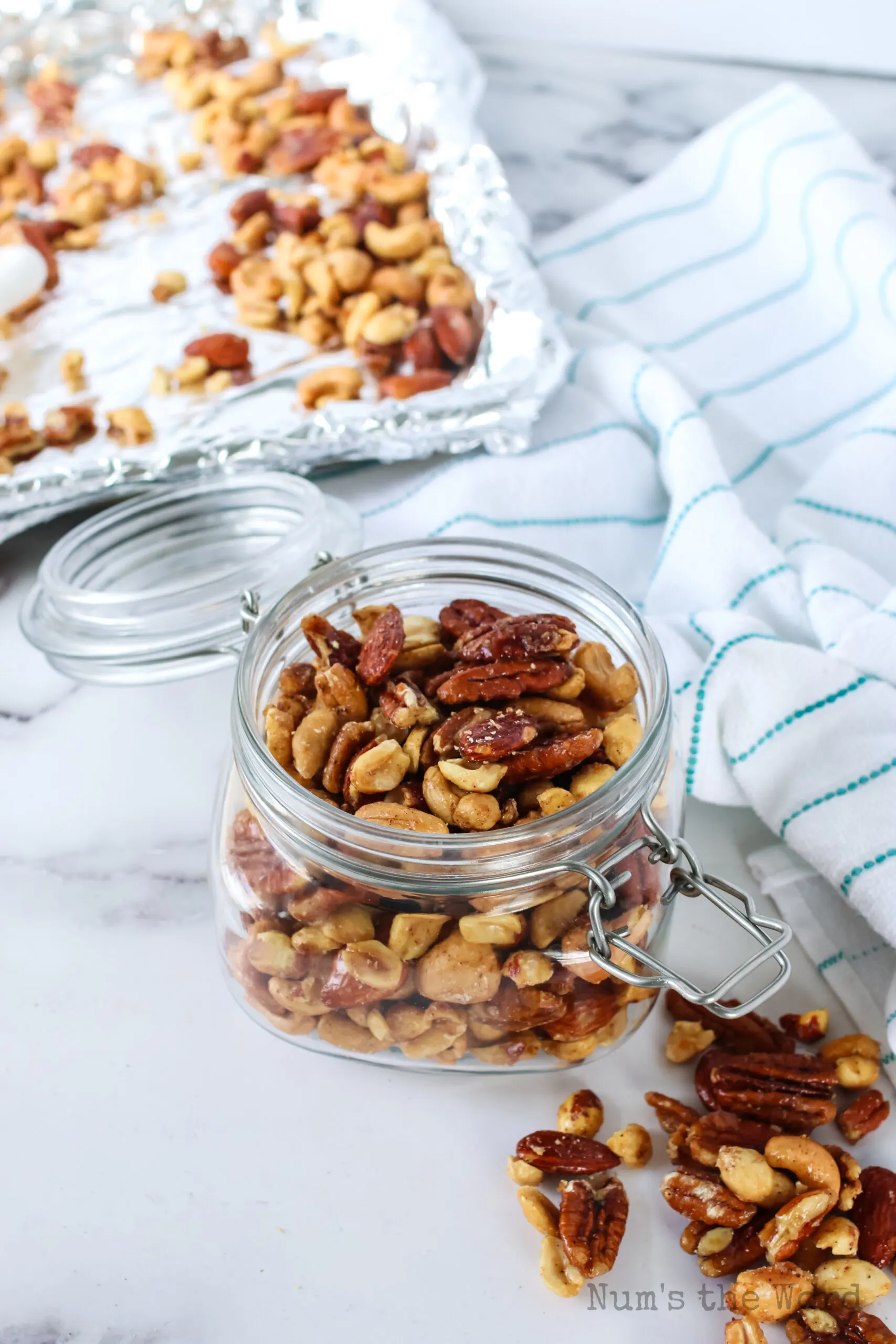 top angled view of candied nuts in a jar