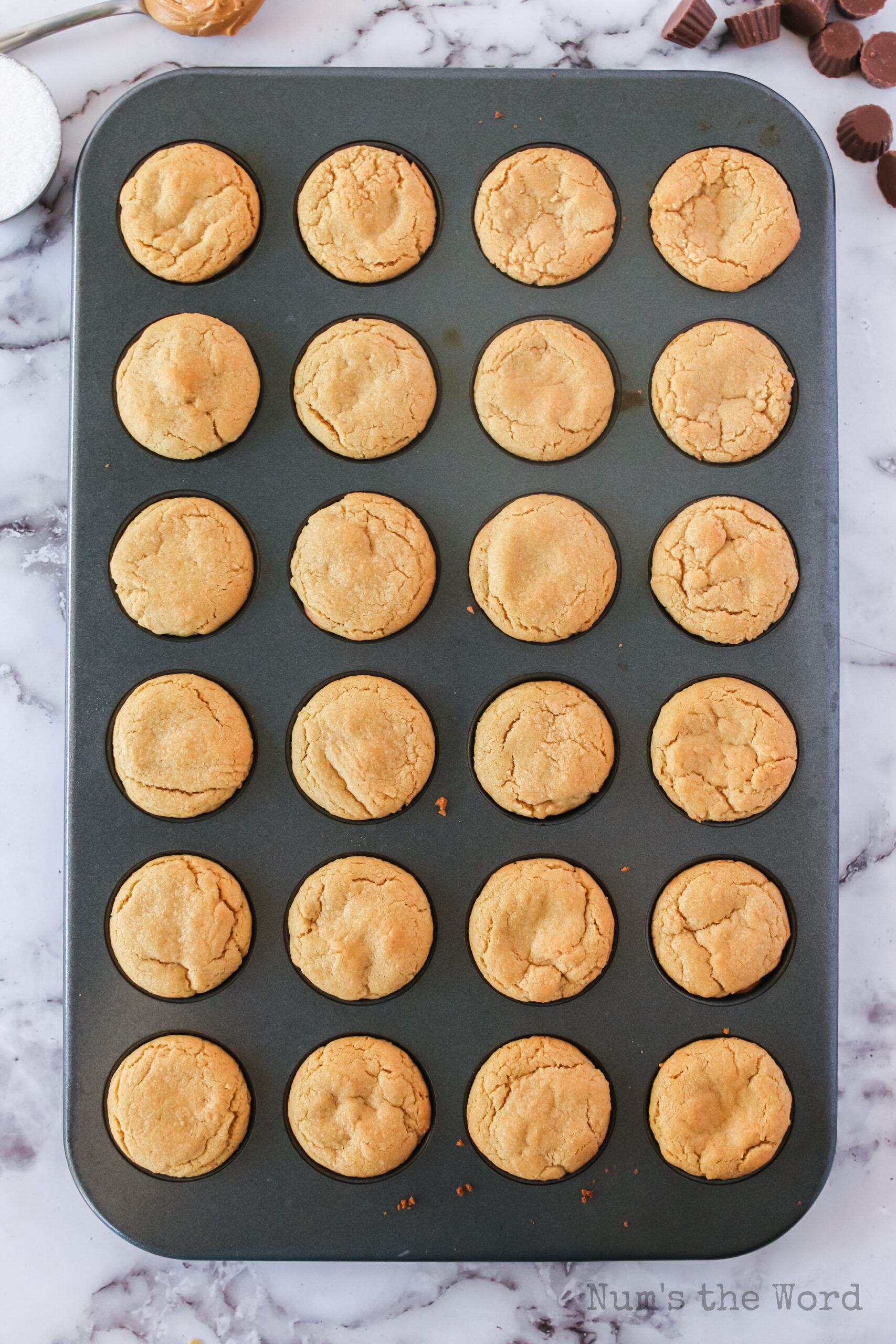Baked peanut butter cookies in mini muffin tin