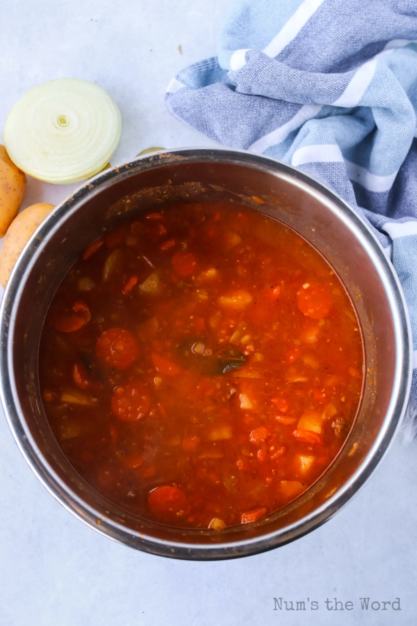 potatoes, carrots, bay leaf and salt added to beef mixture