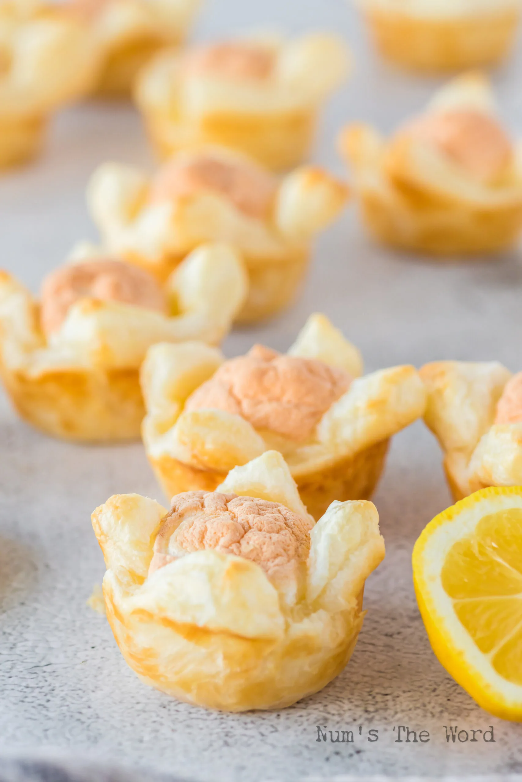 side view of puff pastry dessert cups laid out on counter