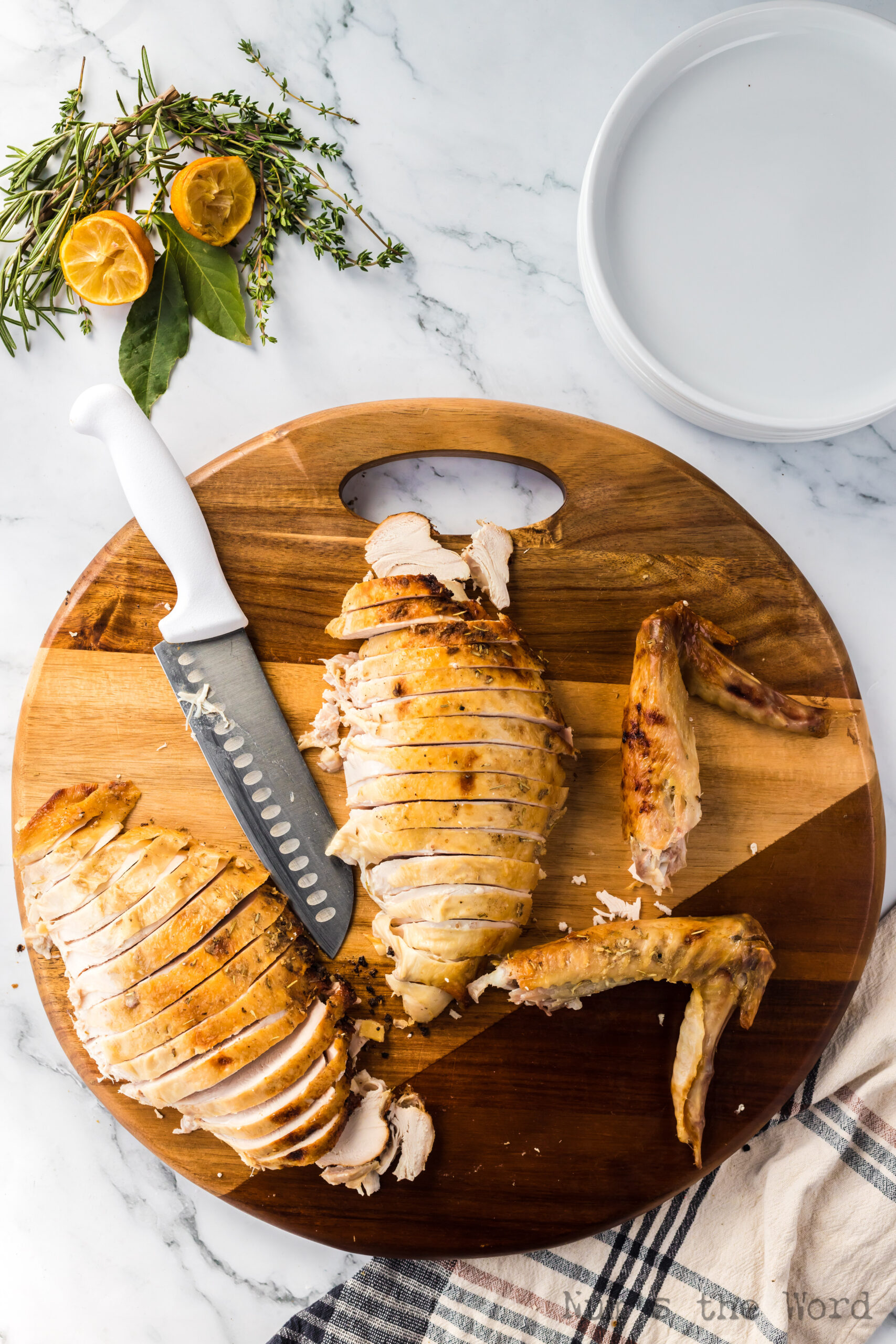 turkey breast laid out on cutting board, sliced and ready to serve