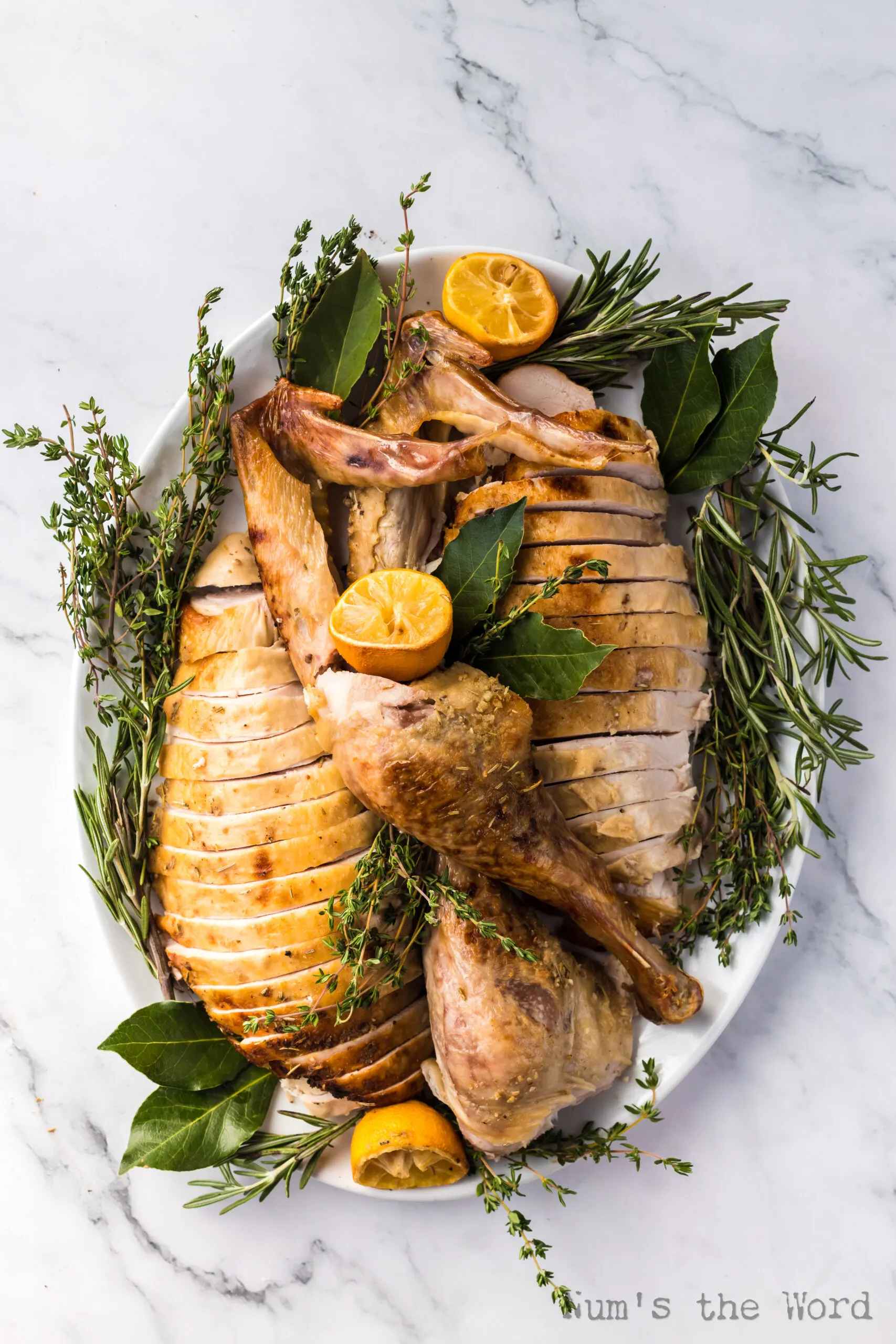 top view looking down at a carved and perfectly displayed turkey on platter