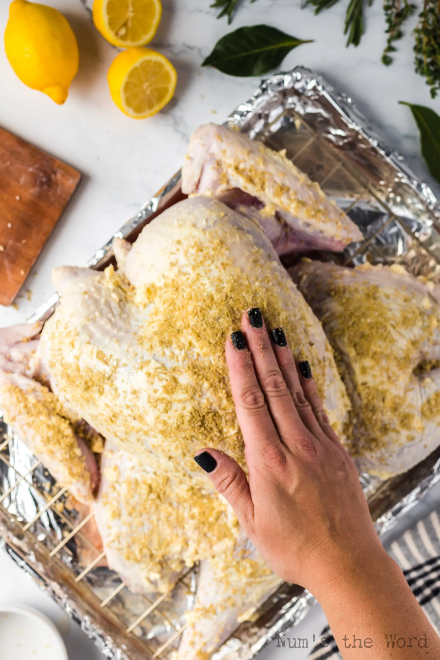 herb seasoning sprinkled and rubbed into the turkey skin