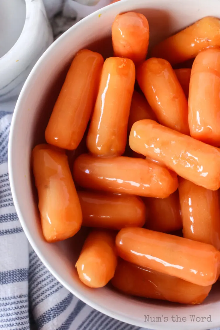 cooked glazed orange carrots in a bowl ready to serve