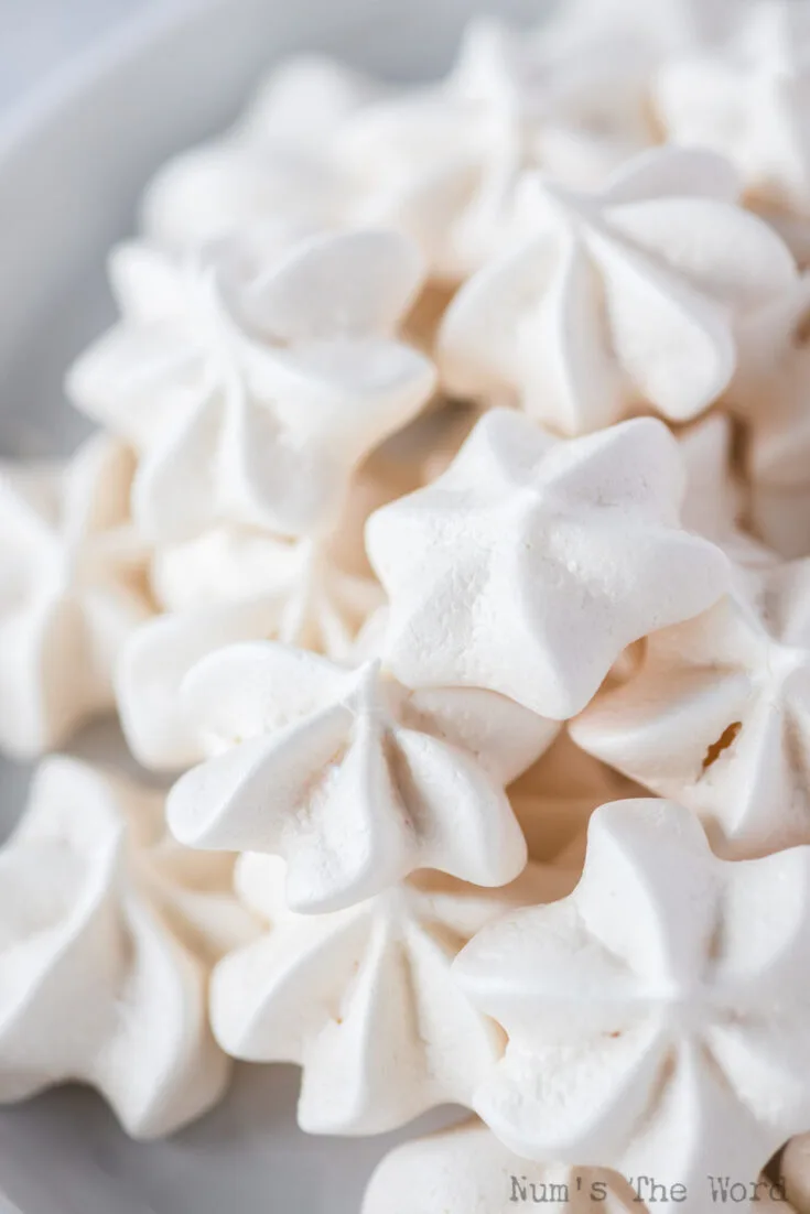 zoomed in image of meringue stars in a bowl ready to serve