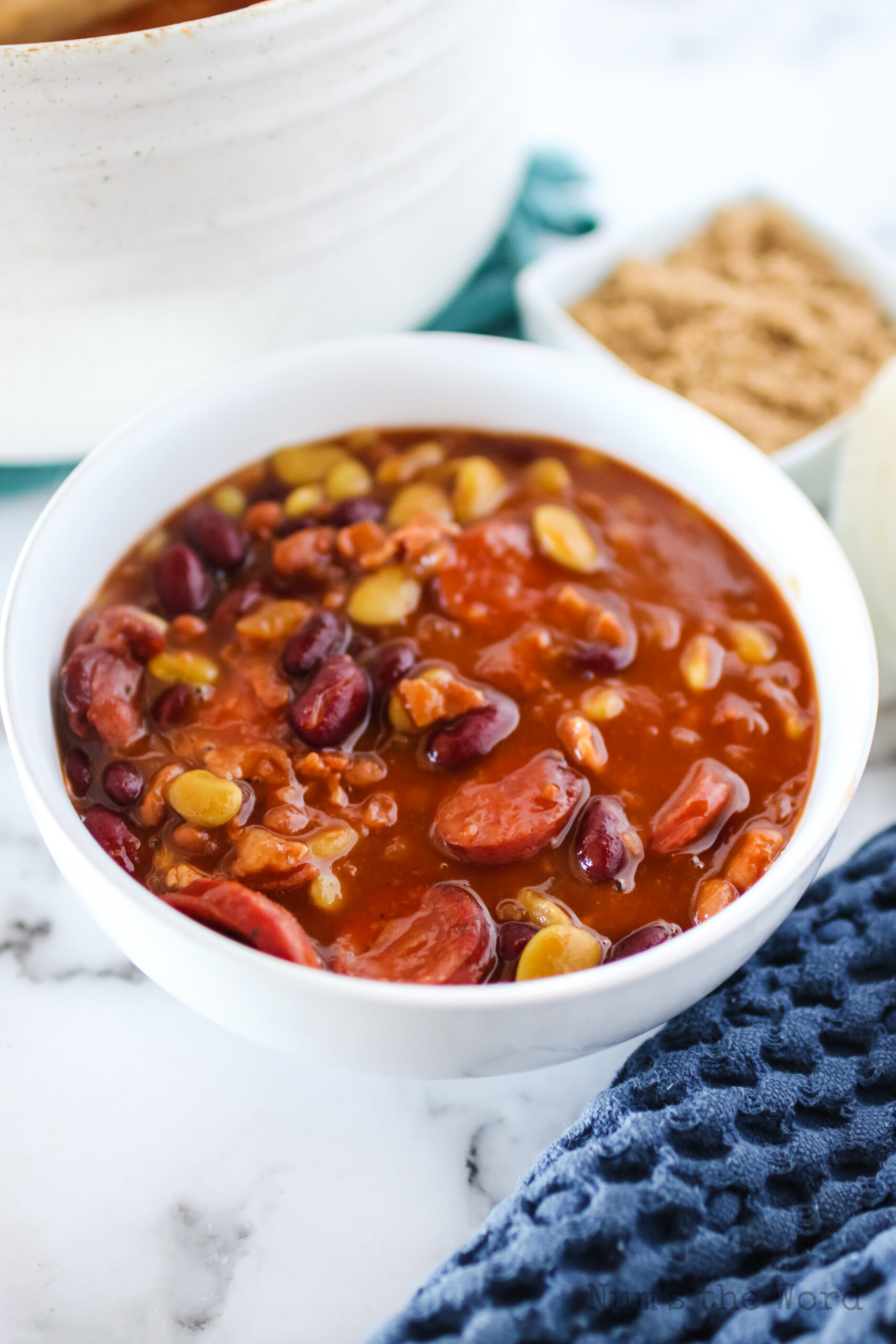 a portion of cowboy baked beans in a bowl ready to eat