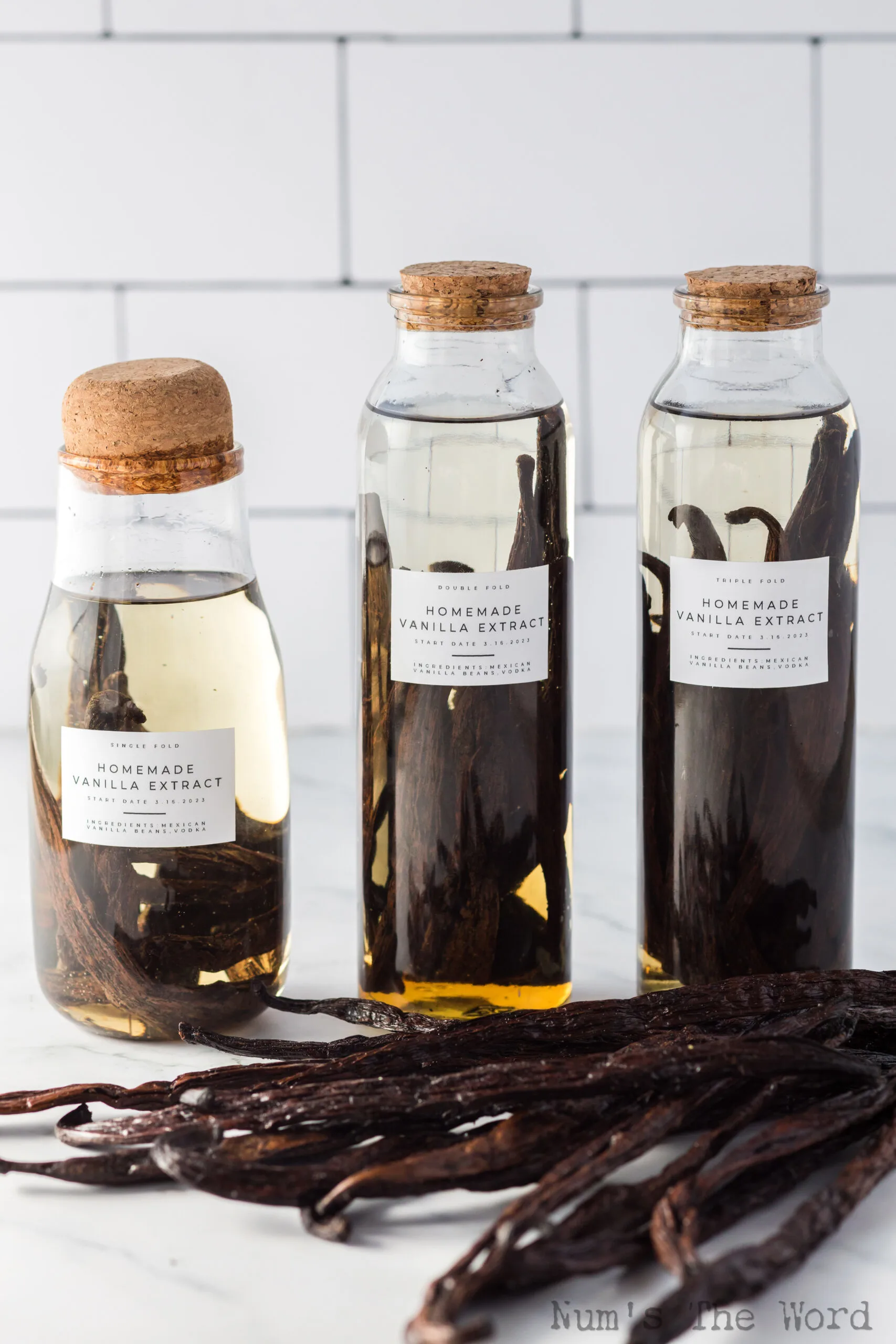 single, double and triple fold vanilla extract on counter