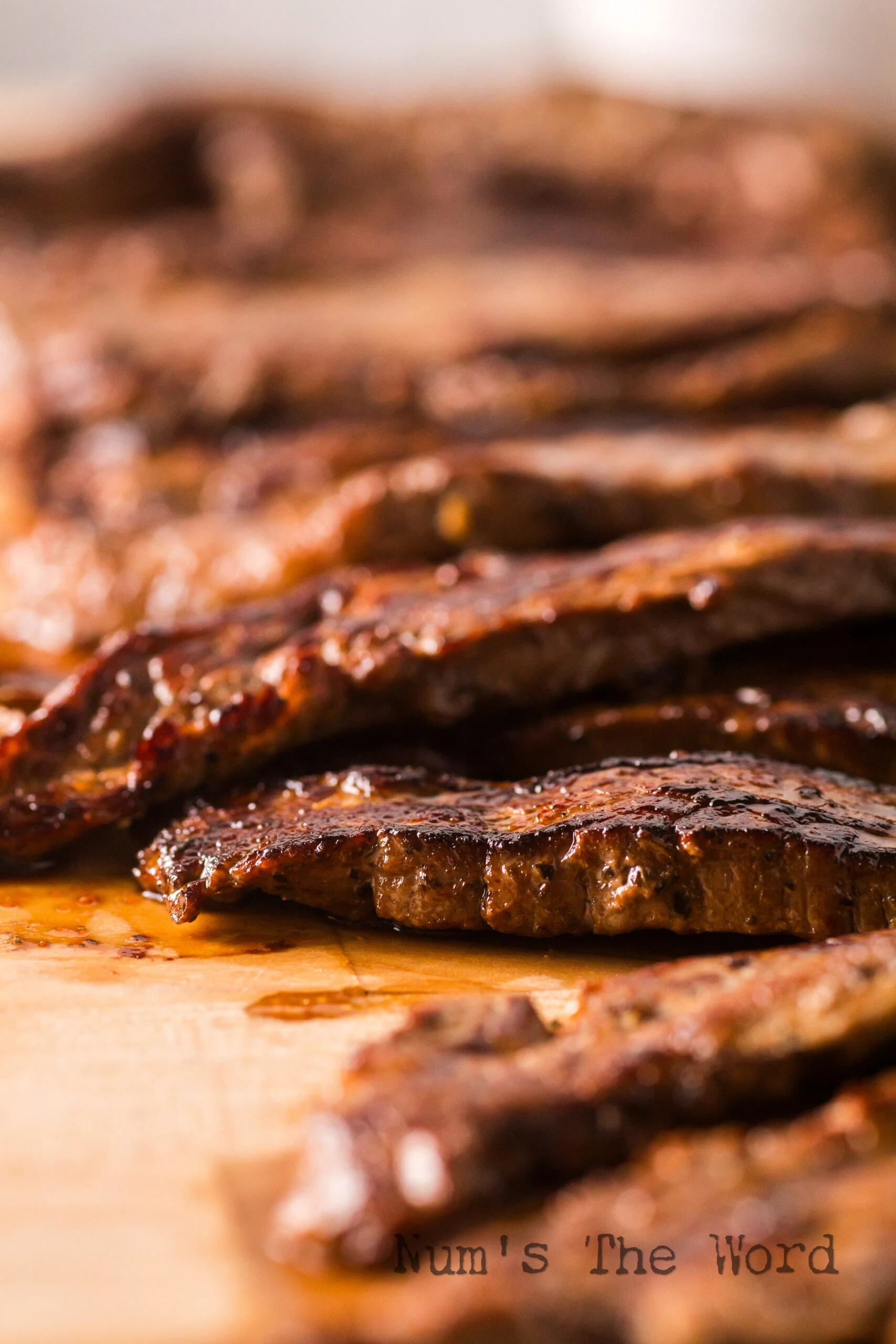cooked steak laid out on cutting board