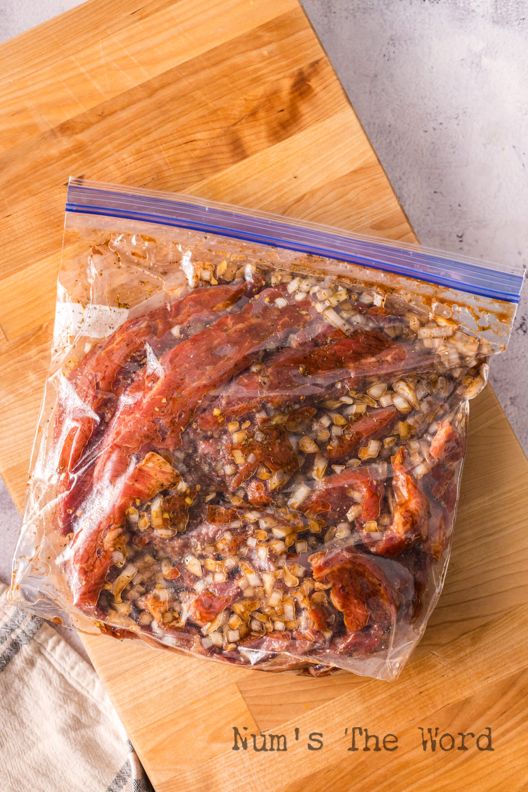 meat and marinade in a zipper bag ready to sit.