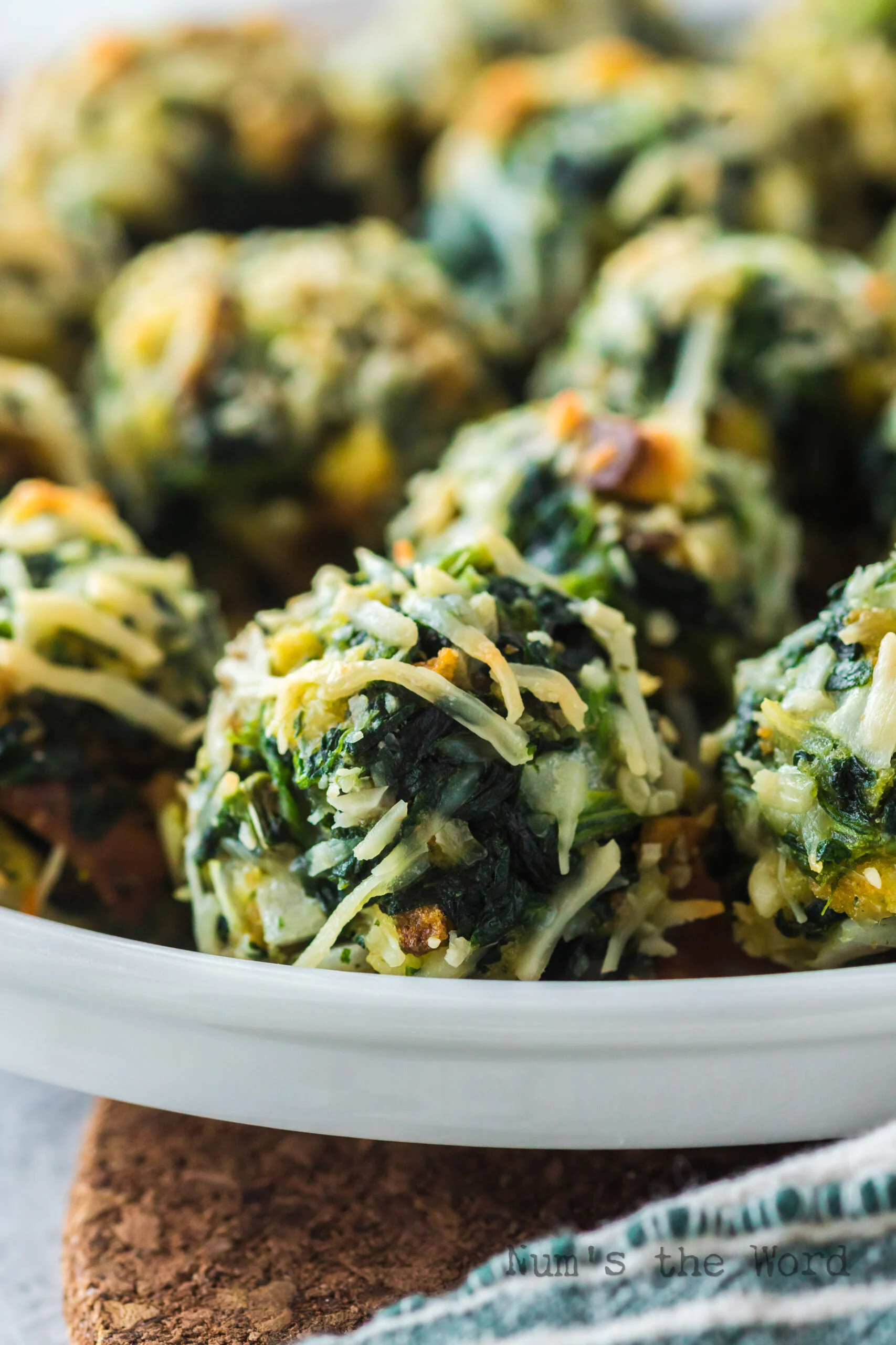 side view of spinach balls on serving platter.