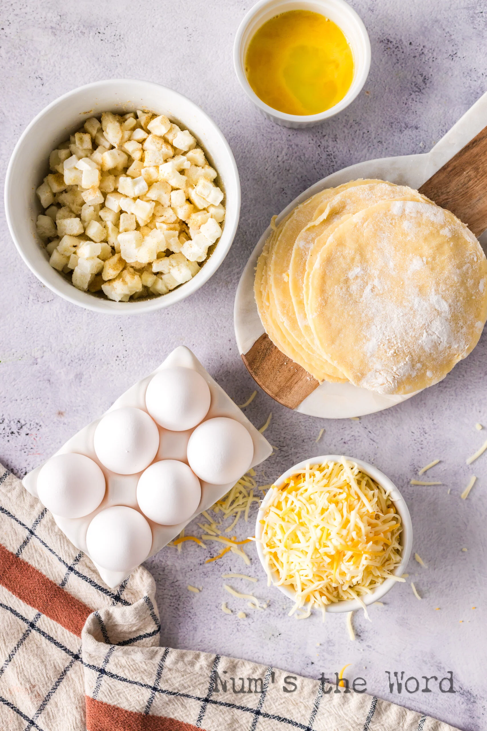 All ingredients for breakfast empanadas laid out on the counter.