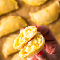 a cooked empanada cut in half to show filling.