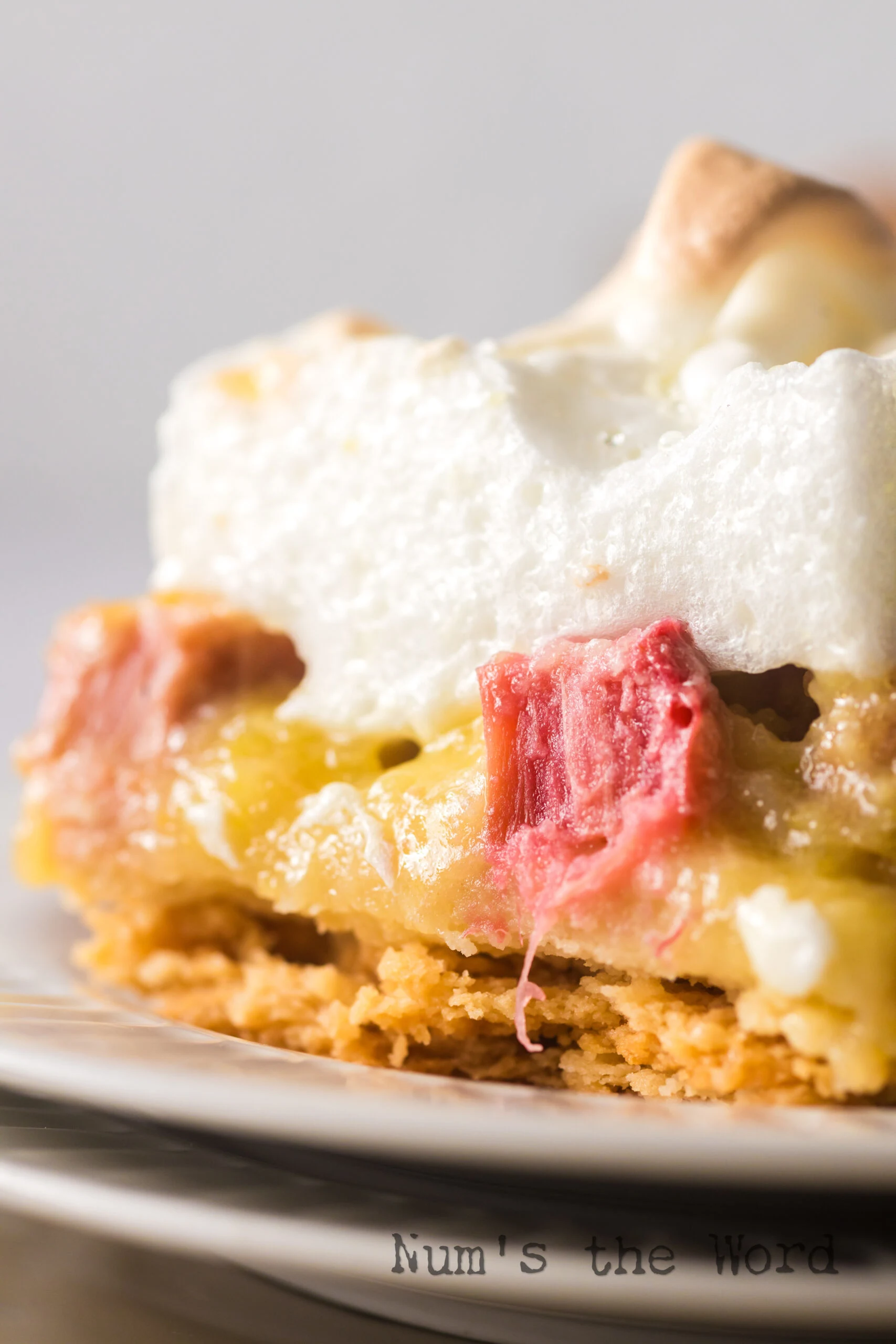 zoomed in image of a slice of dessert on a stack of plates.
