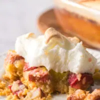 Dessert on plate with a bite removed.