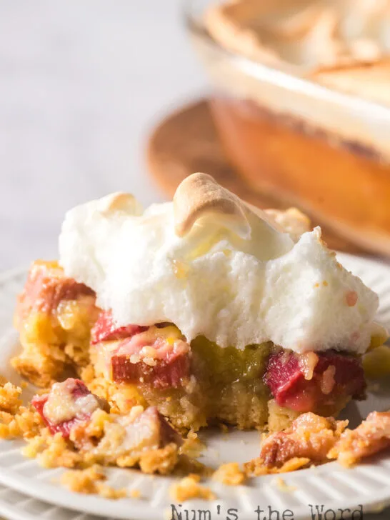 Dessert on plate with a bite removed.