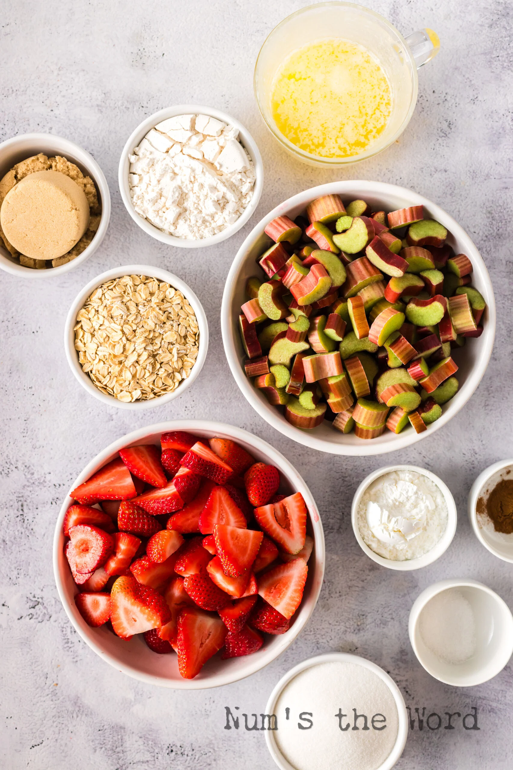All ingredients for Strawberry Rhubarb Crisp laid out on counter.