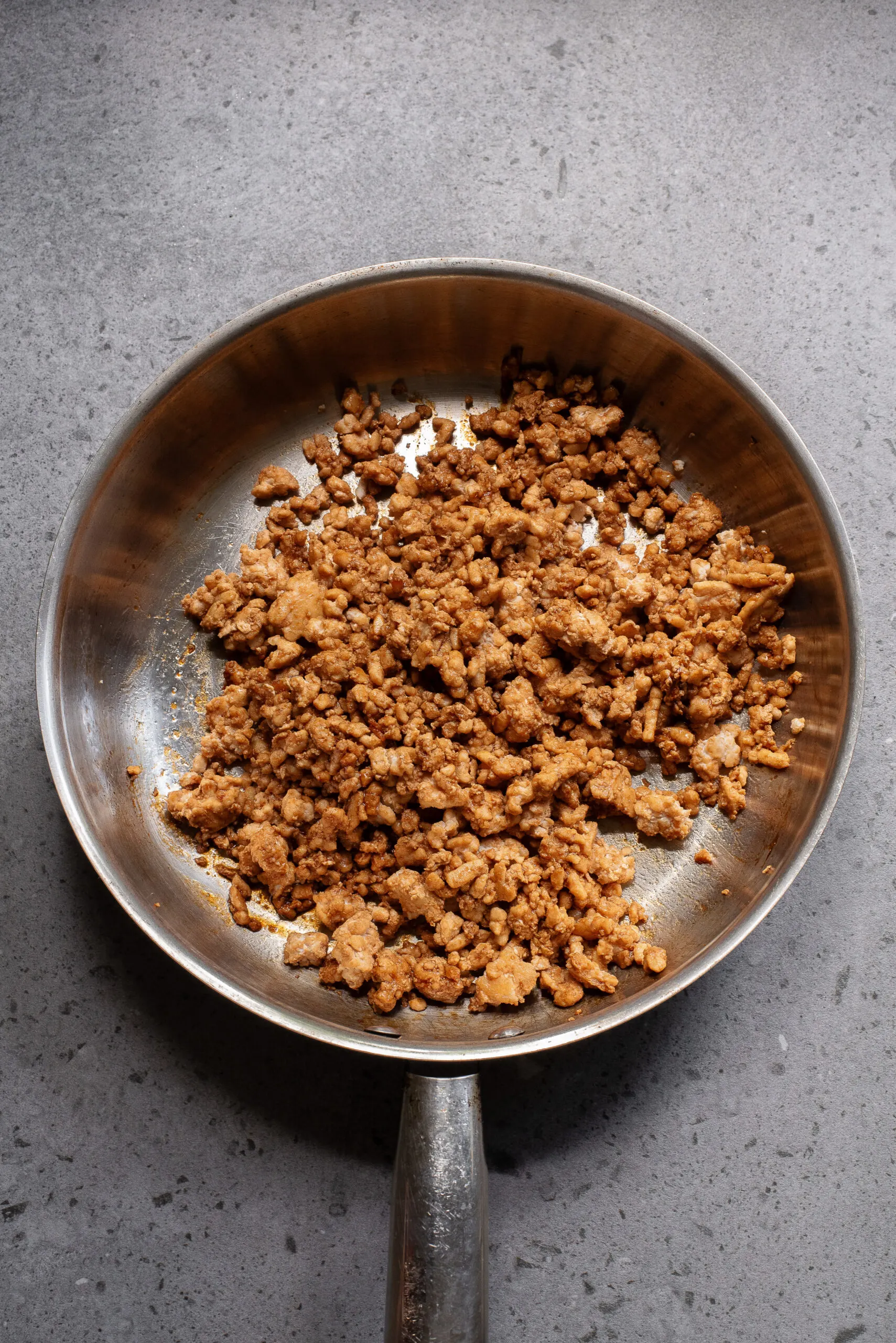 cooked chicken with sauce mixed in.