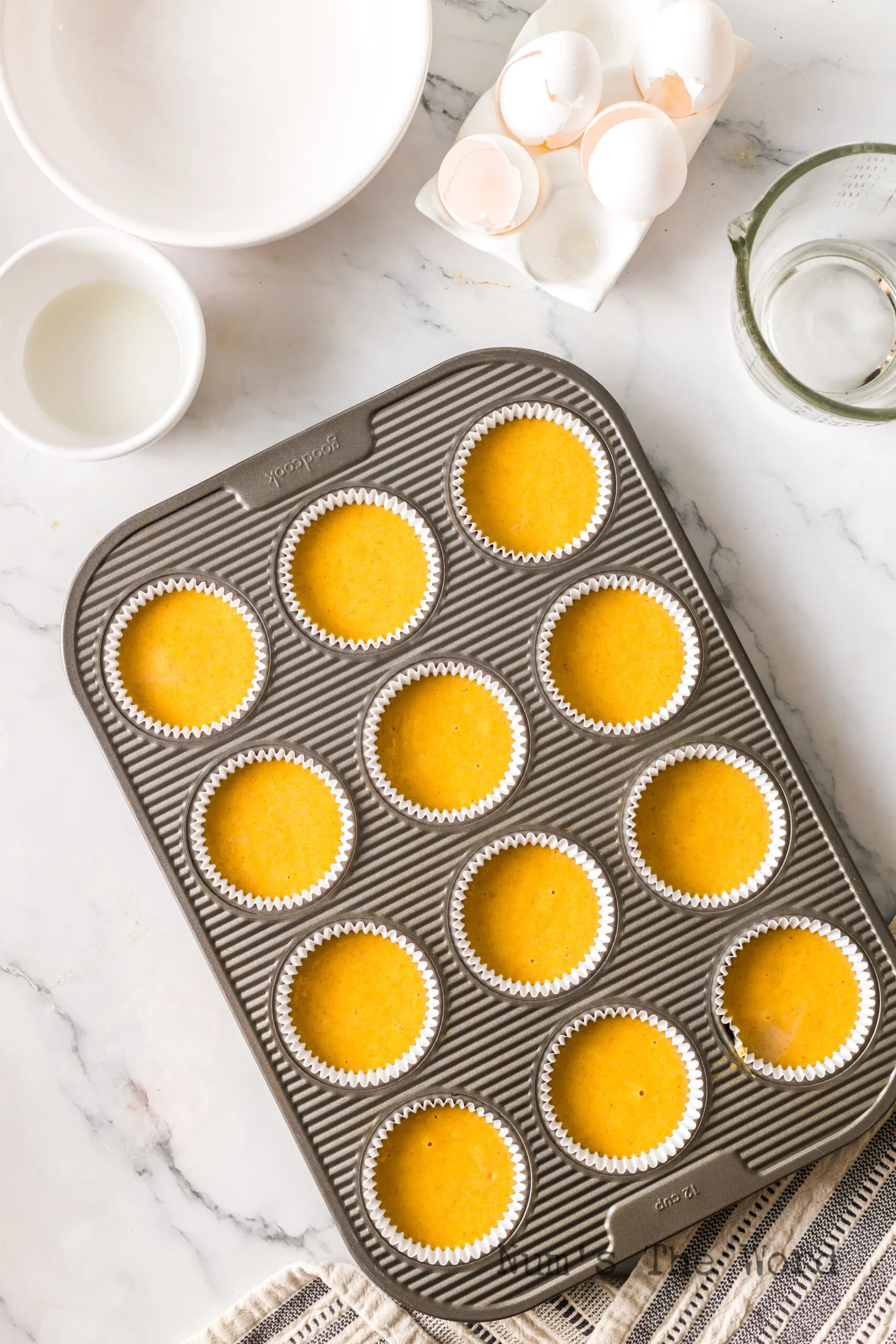 A muffin pan full of batter.